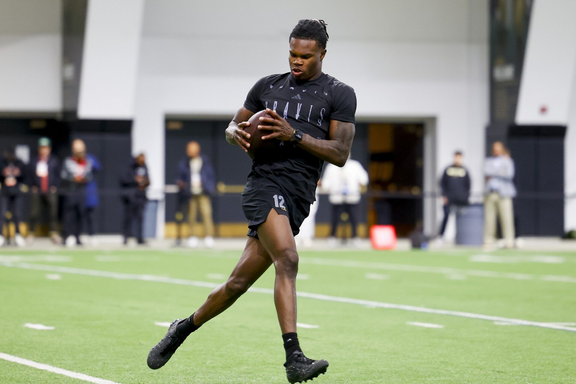 Colorado Buffaloes wide receiver Travis Hunter (12) catches a pass at the University of Colorado NFL Showcase at the CU Indoor Practice Facility.