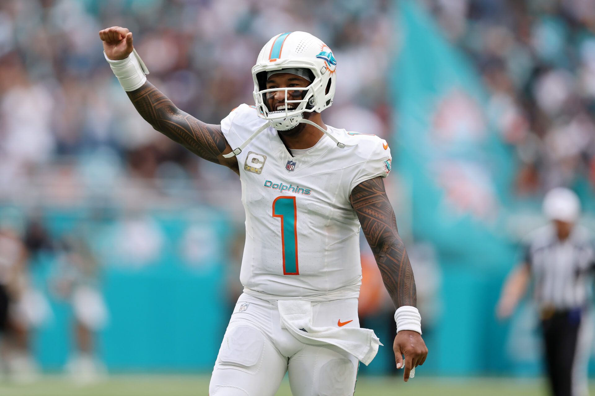 MIAMI GARDENS, FLORIDA - NOVEMBER 17: Tua Tagovailoa #1 of the Miami Dolphins celebrates after a touchdown pass in the fourth quarter of a game against the Las Vegas Raiders at Hard Rock Stadium on November 17, 2024 in Miami Gardens, Florida. (Photo by Megan Briggs/Getty Images)