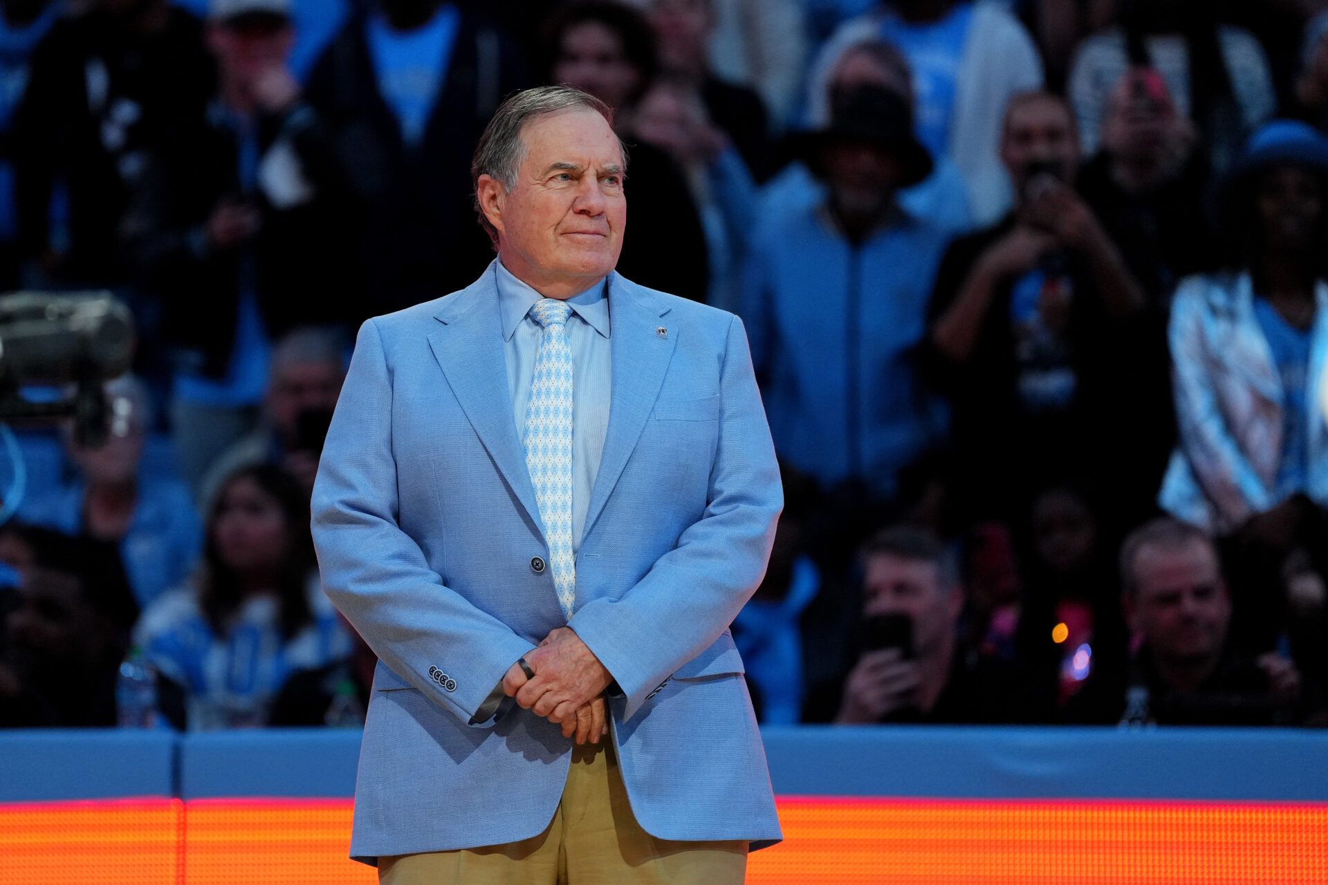 CHAPEL HILL, NORTH CAROLINA - DECEMBER 14: Head coach Bill Belichick of the North Carolina Tar Heels addresses the crowd during halftime in the game against the La Salle Explorers at the Dean E. Smith Center on December 14, 2024 in Greensboro, North Carolina. (Photo by Grant Halverson/Getty Images)