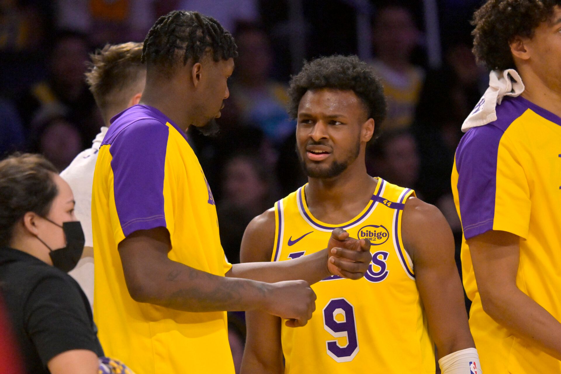 Mar 19, 2025; Los Angeles, California, USA; Los Angeles Lakers guard Bronny James (9) talks with forward Dorian Finney-Smith (17) during a time out in the second half against the Denver Nuggets at Crypto.com Arena. Mandatory Credit: Jayne Kamin-Oncea-Imagn Images