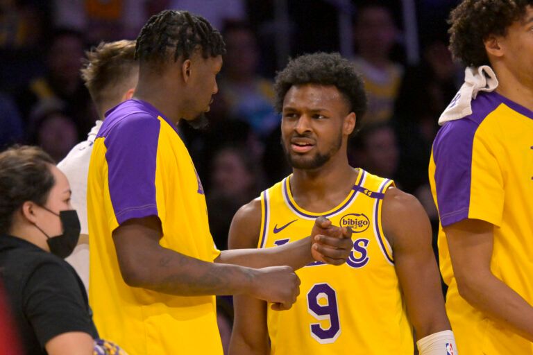 Mar 19, 2025; Los Angeles, California, USA; Los Angeles Lakers guard Bronny James (9) talks with forward Dorian Finney-Smith (17) during a time out in the second half against the Denver Nuggets at Crypto.com Arena. Mandatory Credit: Jayne Kamin-Oncea-Imagn Images