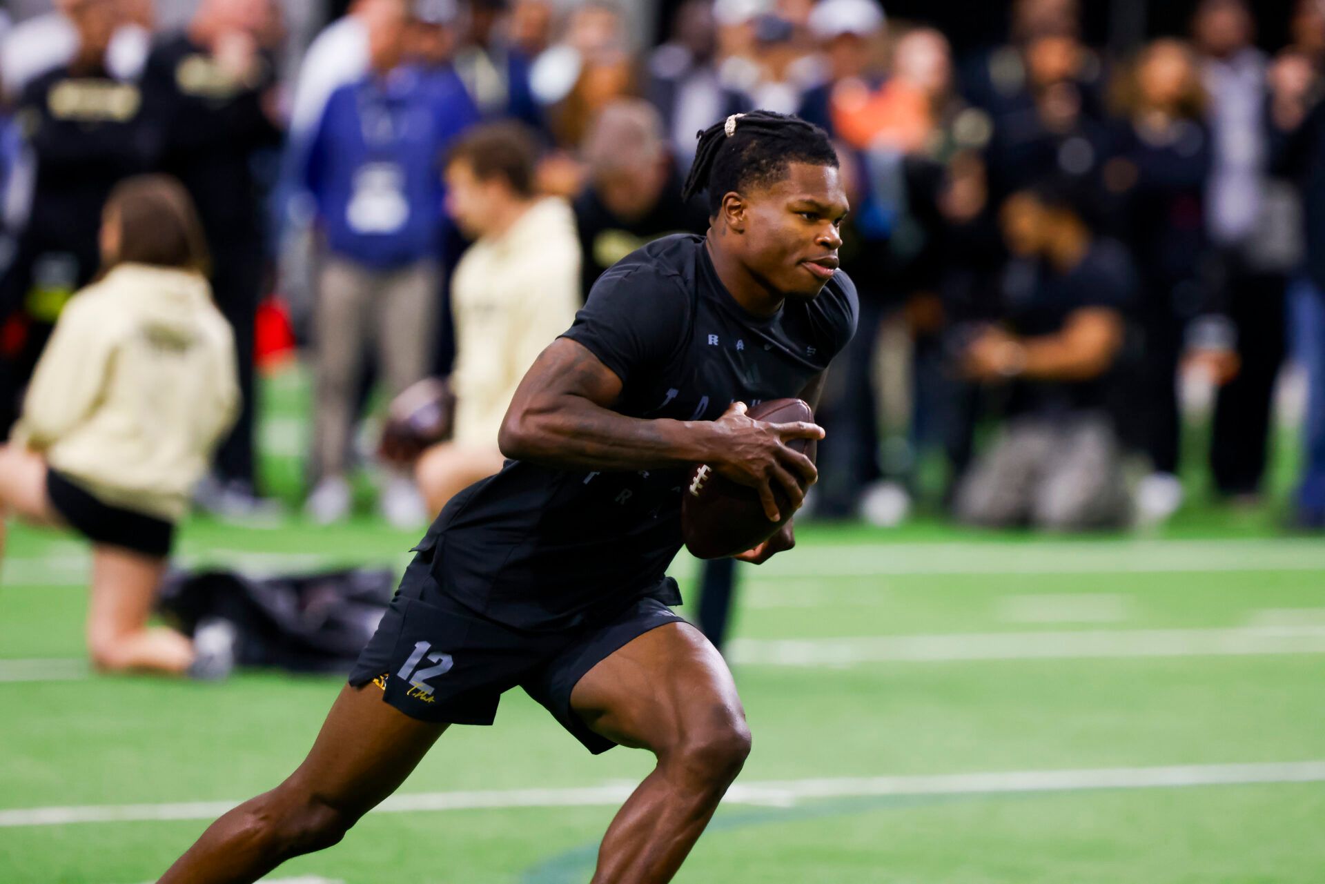 Apr 4, 2025; Boulder, CO, USA; Colorado Buffaloes wide receiver Travis Hunter (12) runs drills at the University of Colorado NFL Showcase at the CU Indoor Practice Facility. Mandatory Credit: Michael Ciaglo-Imagn Images