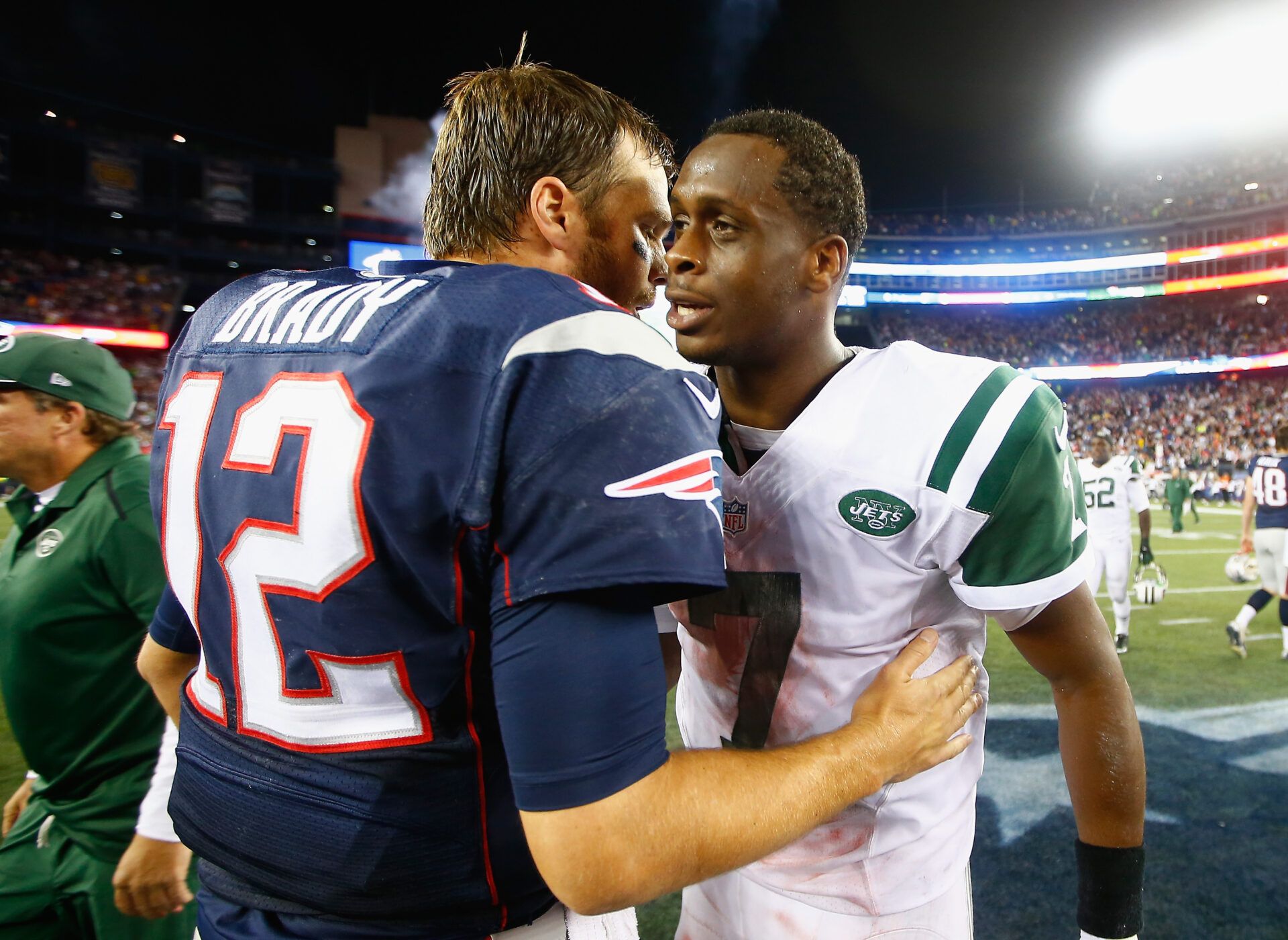 FOXBORO, MA - OCTOBER 16: Geno Smith #7 of the New York Jets hugs Tom Brady #12 of the New England Patriots after a game at Gillette Stadium on October 16, 2014 in Foxboro, Massachusetts. (Photo by Jared Wickerham/Getty Images)