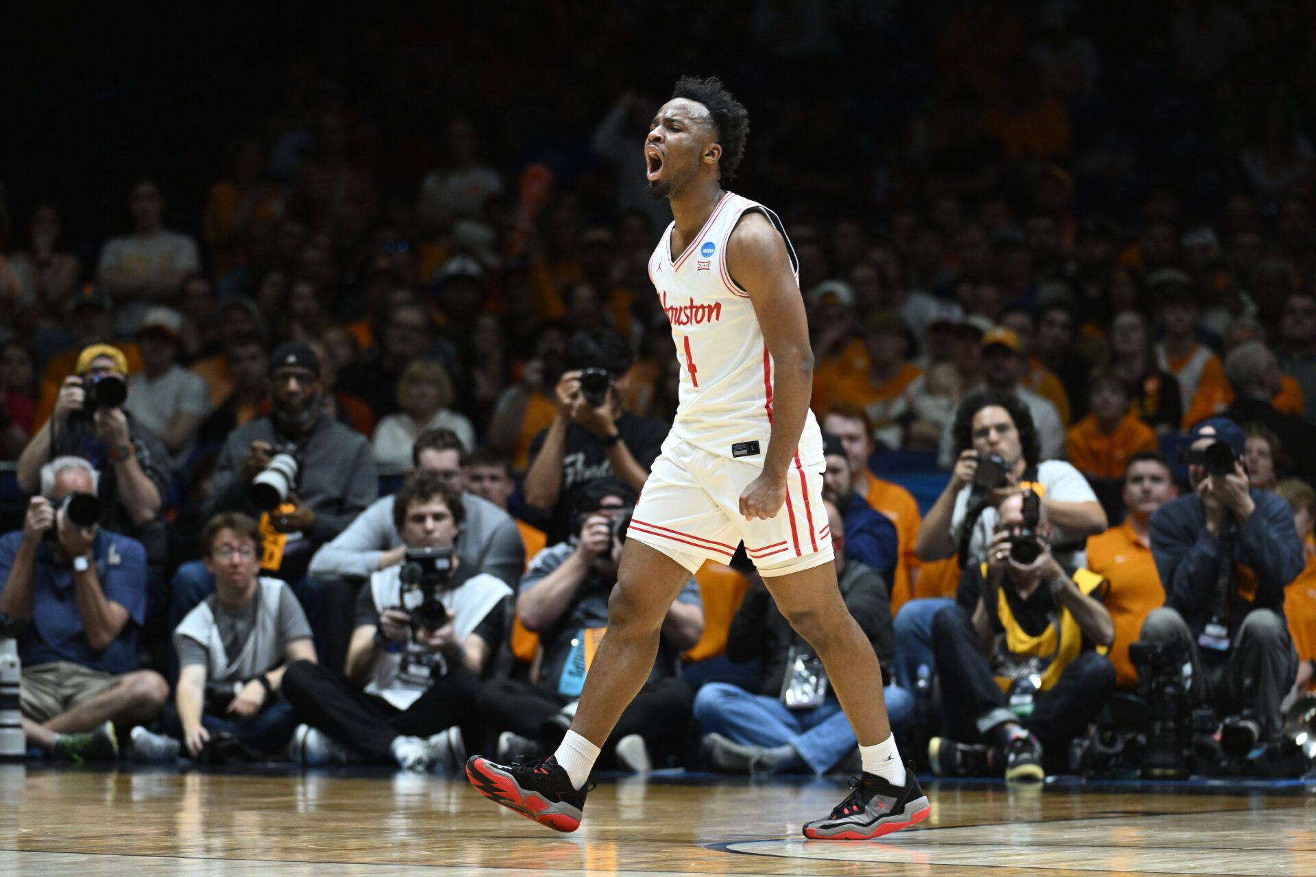 Houston Cougars guard L.J. Cryer (4) reacts against the Tennessee Volunteers in the first half during the Midwest Regional final of the 2025 NCAA tournament at Lucas Oil Stadium.