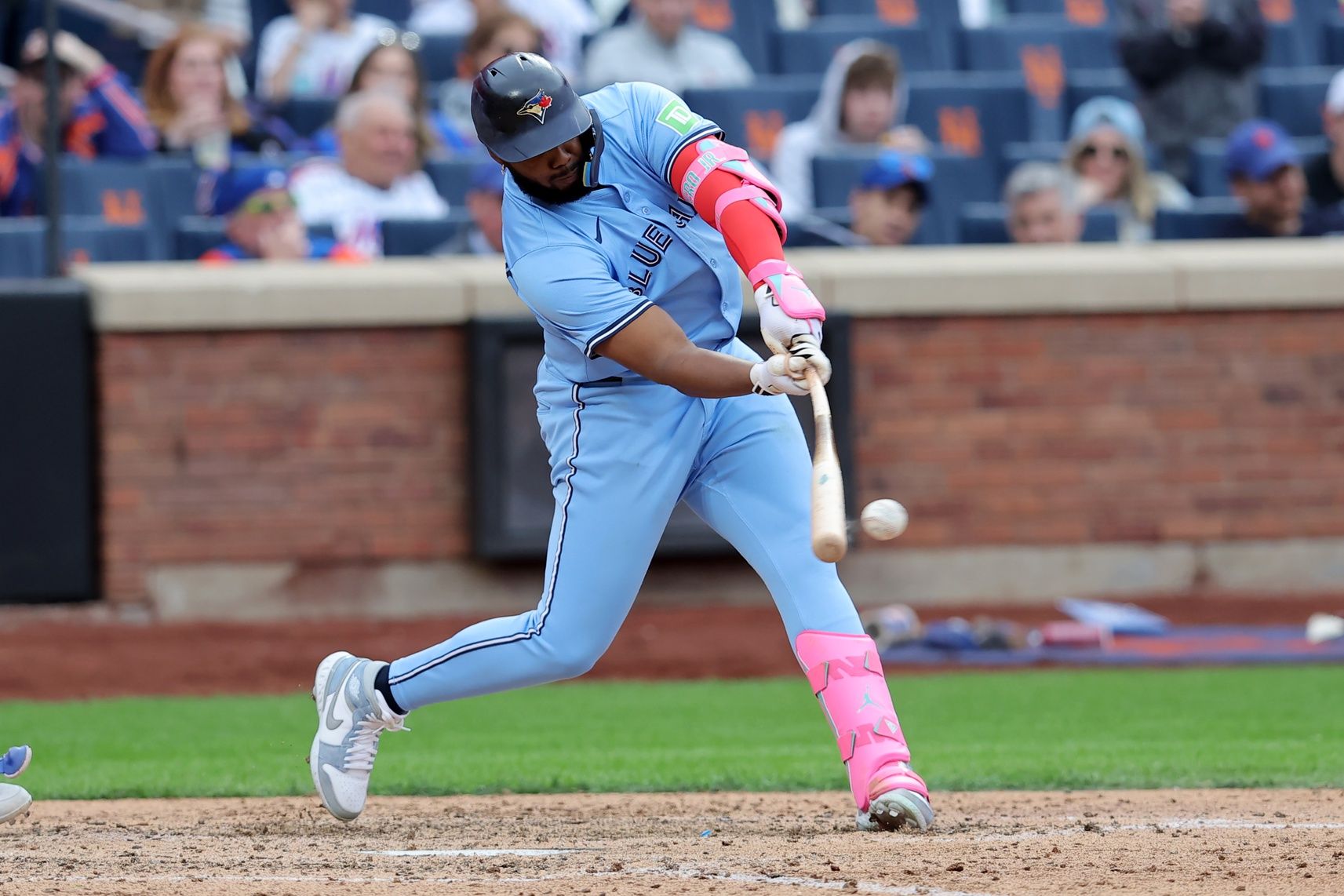 Toronto Blue Jays first baseman Vladimir Guerrero Jr. (27) hits a single during the eighth inning against the New York Mets at Citi Field.