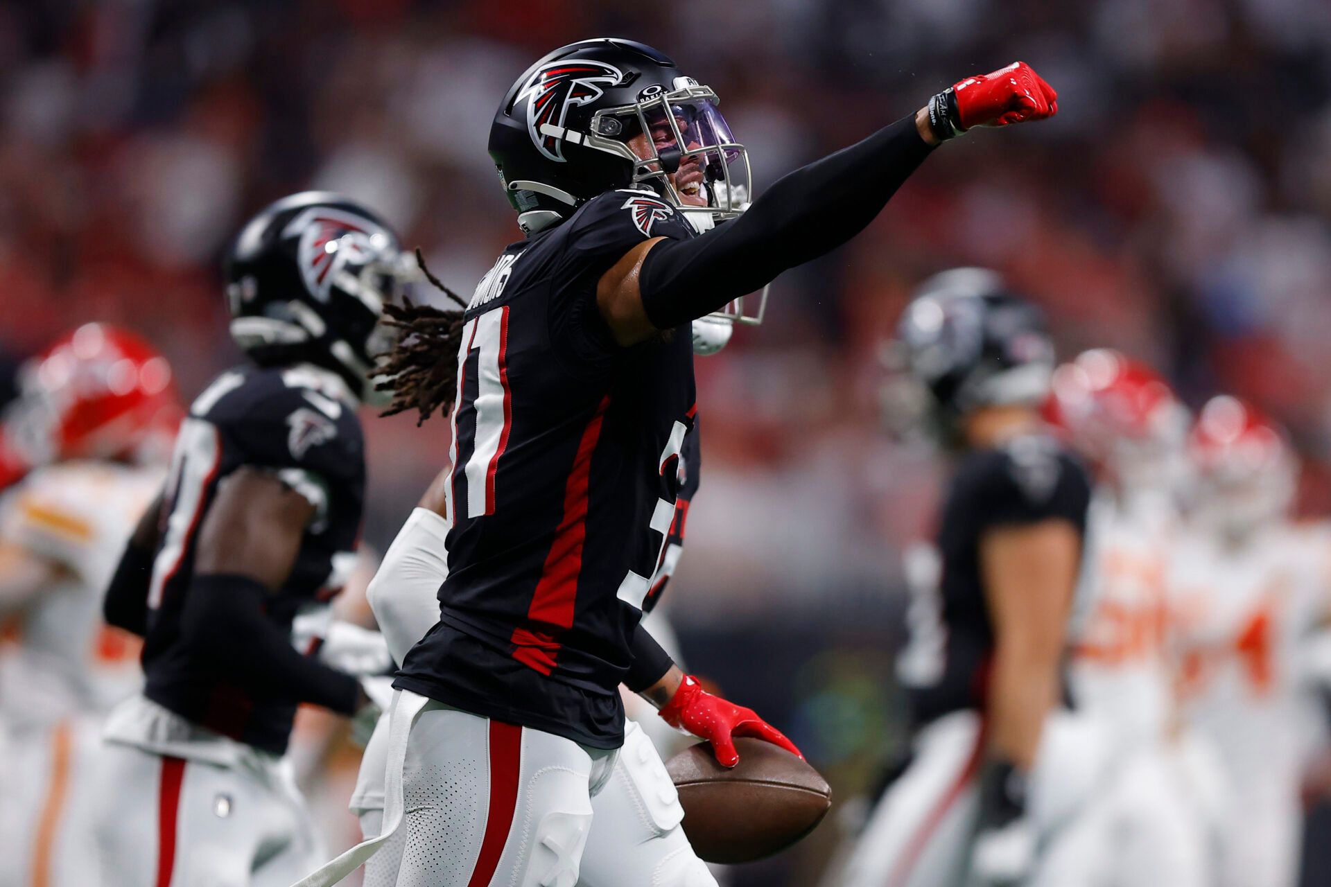 ATLANTA, GEORGIA - SEPTEMBER 22: Justin Simmons #31 of the Atlanta Falcons reacts after an interception during the first quarter in the game against the Kansas City Chiefs at Mercedes-Benz Stadium on September 22, 2024 in Atlanta, Georgia. (Photo by Todd Kirkland/Getty Images)