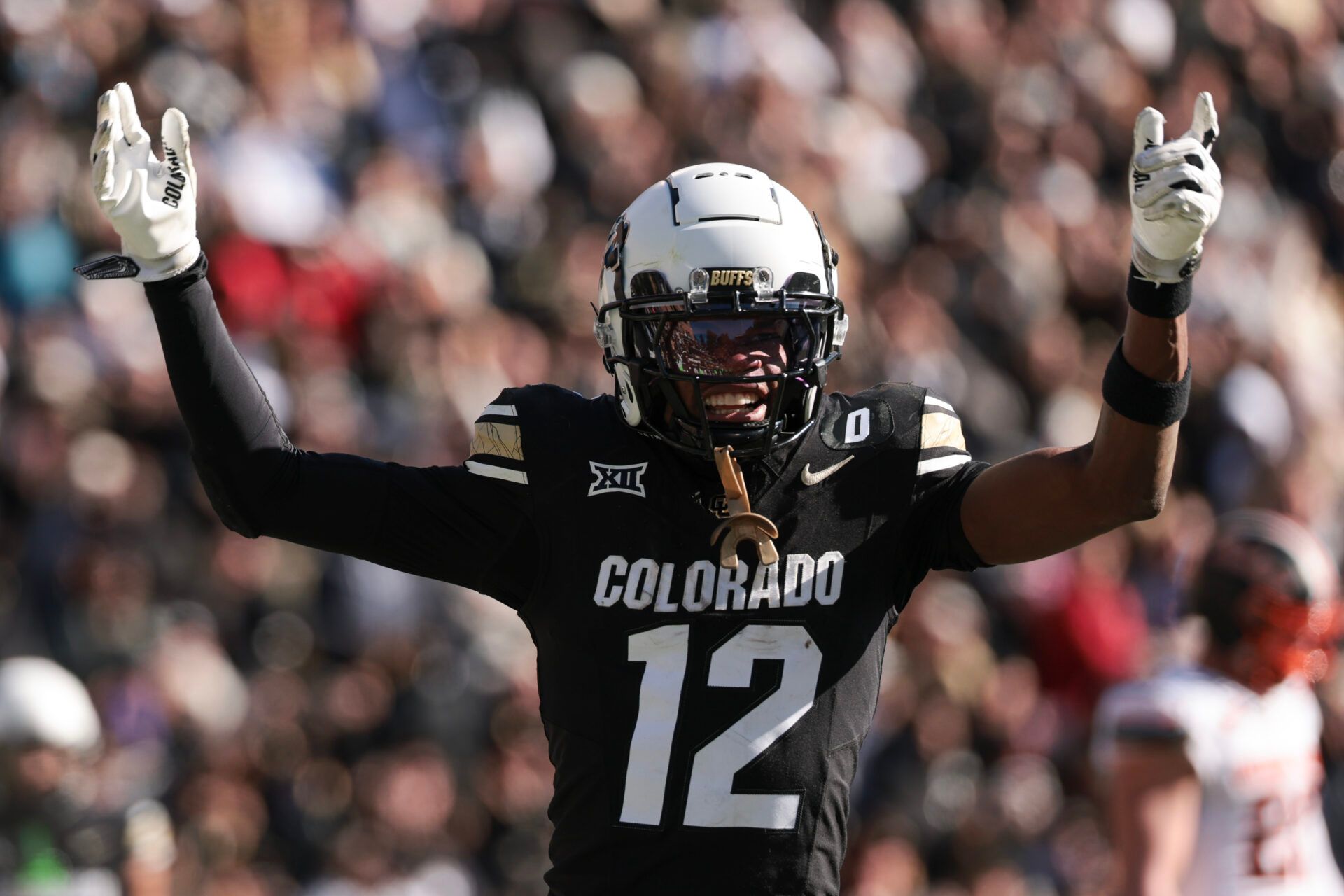 BOULDER, COLORADO - NOVEMBER 29: Travis Hunter #12 of the Colorado Buffaloes celebrates a touchdown during the third quarter against the Oklahoma State Cowboys at Folsom Field on November 29, 2024 in Boulder, Colorado. (Photo by Andrew Wevers/Getty Images)