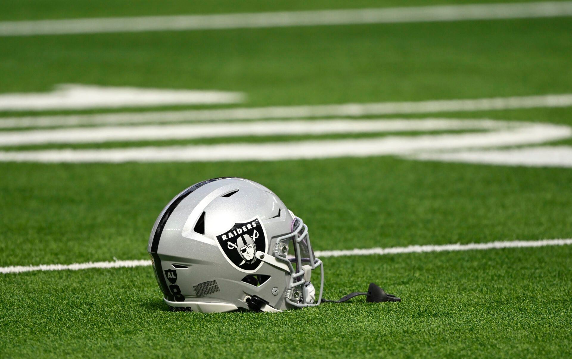 Oct 20, 2024; Inglewood, California, USA; Las Vegas Raiders helmet on the turn at SoFi Stadium during pregame warmups before an NFL game against the Los Angeles Rams. Mandatory Credit: Robert Hanashiro-Imagn Images
