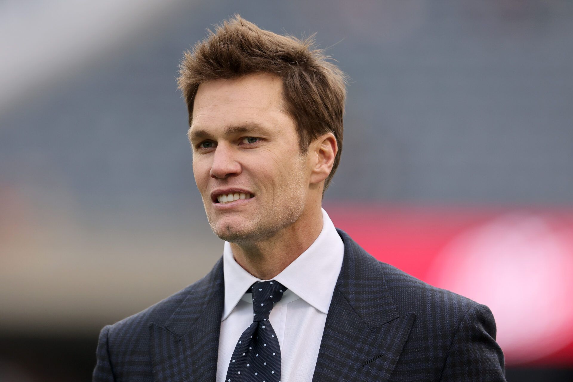 CHICAGO, ILLINOIS - NOVEMBER 17: Former NFL player Tom Brady looks on prior to a game between the Chicago Bears and the Green Bay Packers at Soldier Field on November 17, 2024 in Chicago, Illinois. (Photo by Michael Reaves/Getty Images)