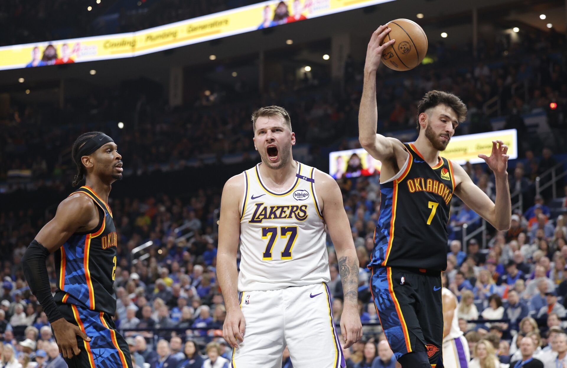 Los Angeles Lakers guard Luka Doncic (77) yells after scoring against the Oklahoma City Thunder during the second quarter at Paycom Center.