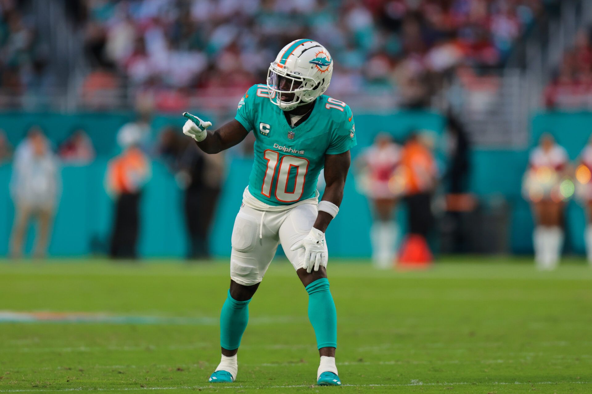 Dec 22, 2024; Miami Gardens, Florida, USA; Miami Dolphins wide receiver Tyreek Hill (10) signals from the line of scrimmage against the San Francisco 49ers during the second quarter at Hard Rock Stadium. Mandatory Credit: Sam Navarro-Imagn Images