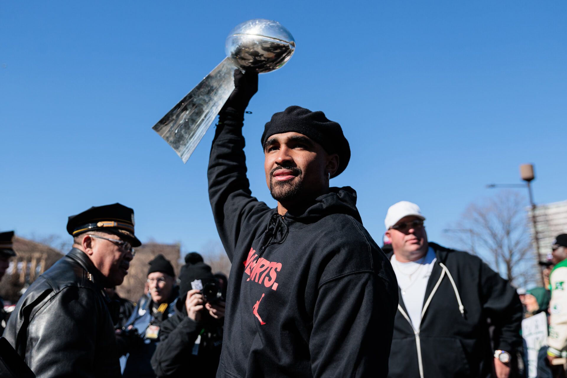 Feb 14, 2025; Philadelphia, PA, USA; Philadelphia Eagles quarterback Jalen Hurts (1) raises the Lombardi Trophy during the Super Bowl LIX championship parade and rally. Mandatory Credit: Caean Couto-Imagn Images