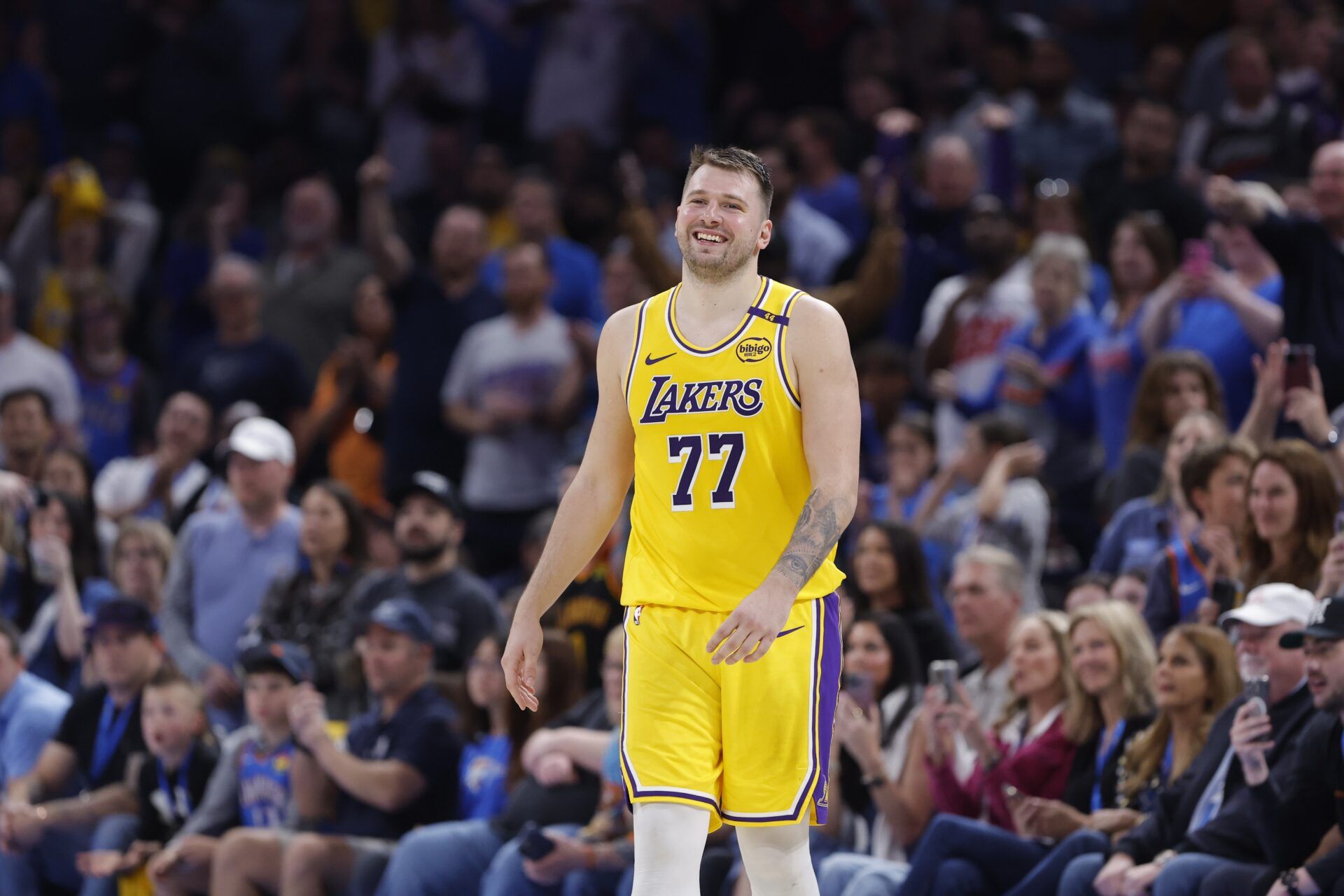 Los Angeles Lakers guard Luka Doncic (77) smiles after a technical is called against him during the second half of a game against the Oklahoma City Thunder at Paycom Center.