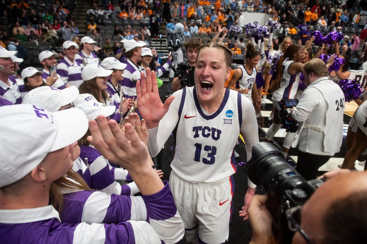 TCU Horned Frogs center Sedona Prince (13) celebrates with the marching band as TCU Horned Frogs face off with Notre Dame Fighting Irish during the Sweet 16 at Legacy Arena in Birmingham, Ala., on Saturday, March 29, 2025. TCU Horned Frogs defeated Notre Dame Fighting Irish 71-62 to advance to the Elite 8.