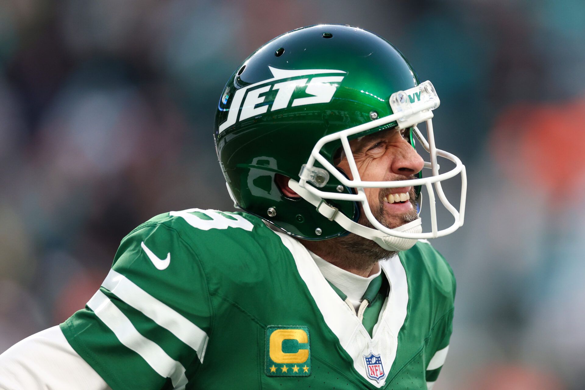 EAST RUTHERFORD, NEW JERSEY - JANUARY 05: Aaron Rodgers #8 of the New York Jets reacts after throwing an interception against the Miami Dolphins during the first quarter at MetLife Stadium on January 05, 2025 in East Rutherford, New Jersey. (Photo by Luke Hales/Getty Images)