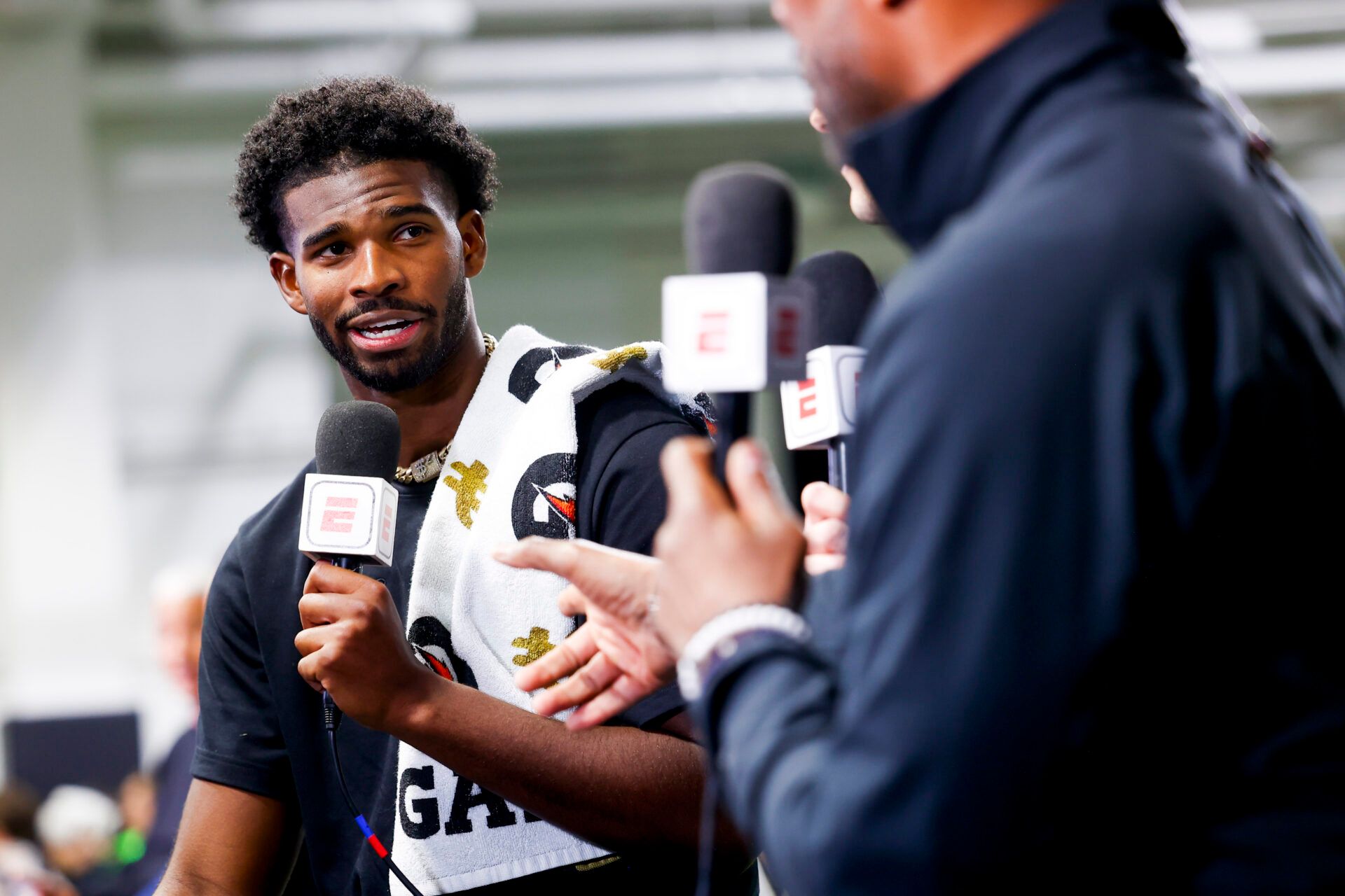 Apr 4, 2025; Boulder, CO, USA; Colorado Buffaloes quarterback Shedeur Sanders (2) talks to ESPN after the University of Colorado NFL Showcase at the CU Indoor Practice Facility. Mandatory Credit: Michael Ciaglo-Imagn Images