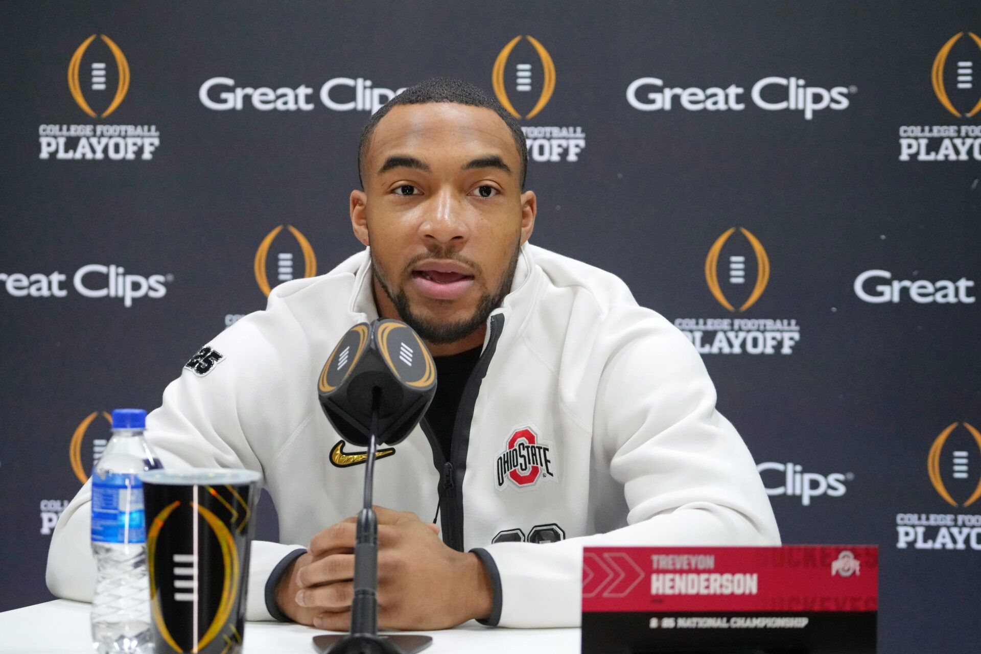 Jan 18, 2025; Atlanta, GA, USA; Ohio State Buckeyes running back TreVeyon Henderson (32) talks to the media during 2025 CFP National Championship Media Day at Georgia World Congress Center, Building A. Mandatory Credit: Kirby Lee-Imagn Images
