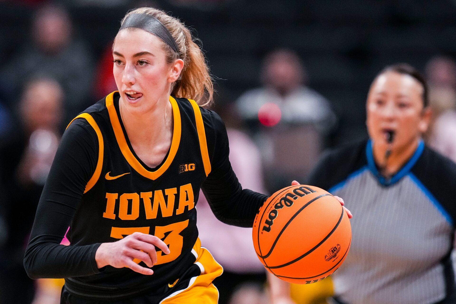Iowa Hawkeyes guard Lucy Olsen (33) brings the ball up the court Friday, March 7, 2025, in a quarterfinals game at the 2025 TIAA Big Ten Women's Basketball Tournament between the Iowa Hawkeyes and the Ohio State Buckeyes at Gainbridge Fieldhouse in Indianapolis.