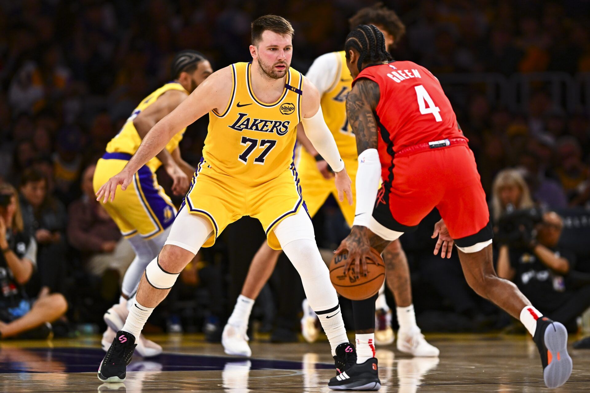 Los Angeles Lakers guard Luka Doncic (77) defends against Houston Rockets guard Jalen Green (4) during the first half at Crypto.com Arena.