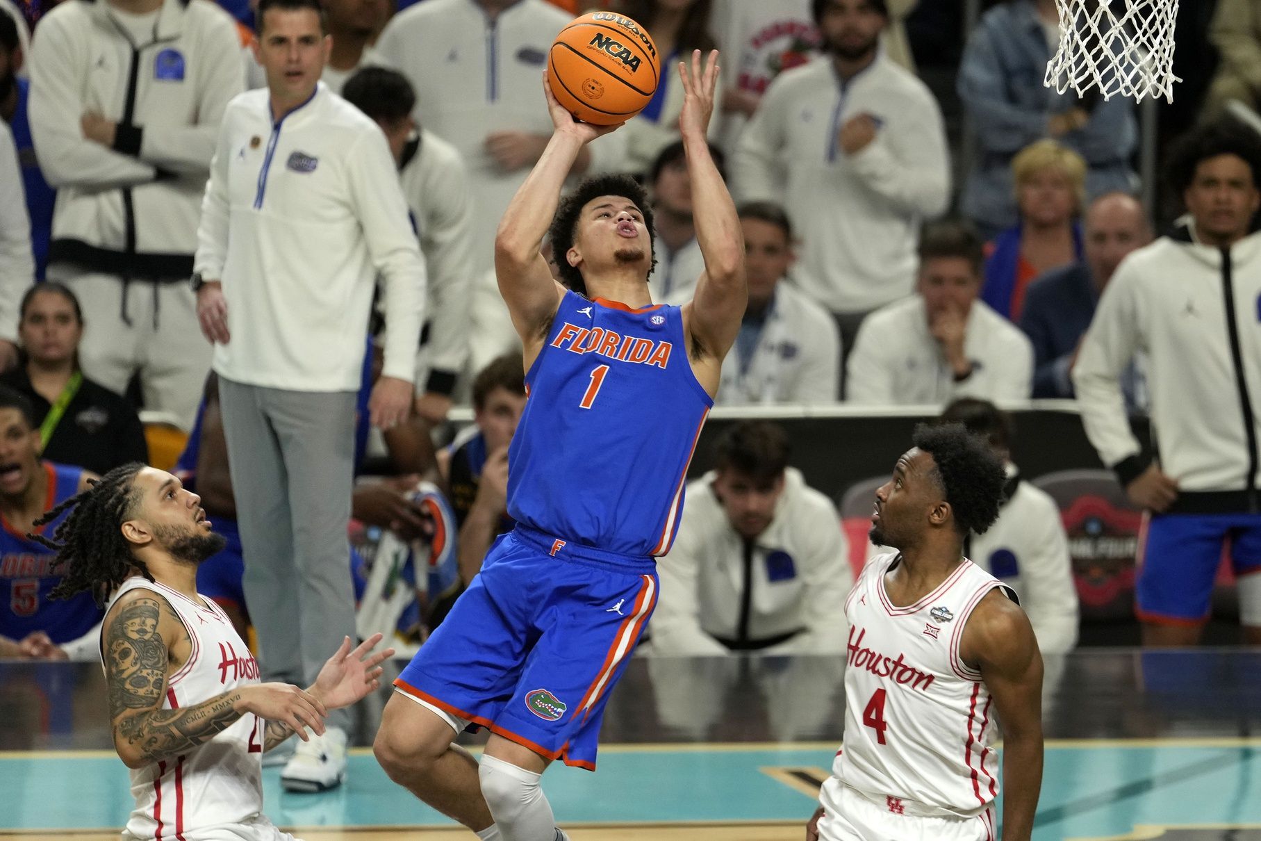 Florida Gators guard Walter Clayton Jr. (1) shoots the ball against Houston Cougars guard L.J. Cryer (4) during the second half in the national championship game of the Final Four of the 2025 NCAA Tournament at the Alamodome.