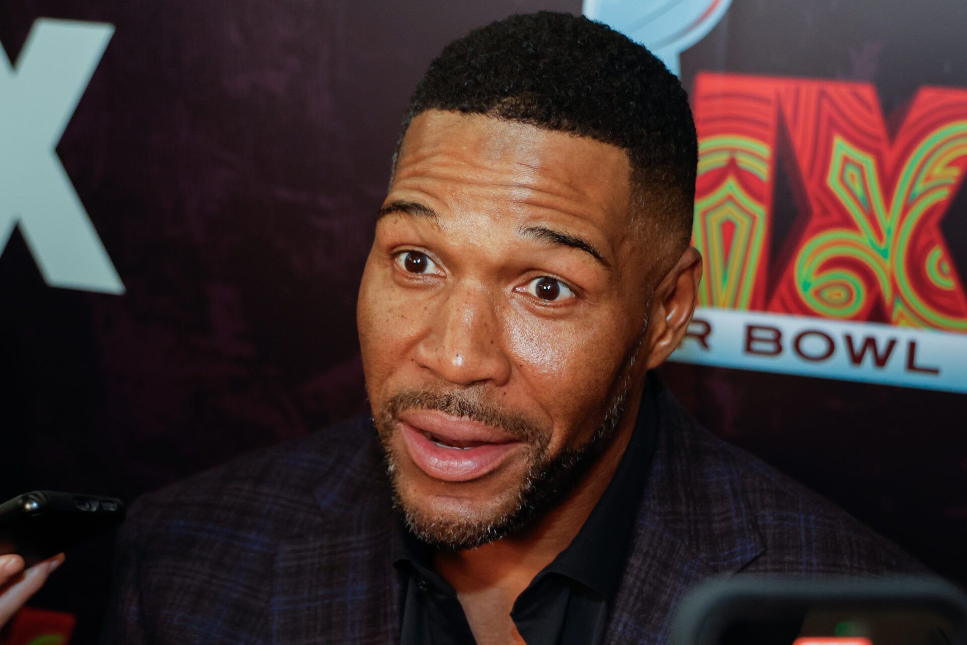 Michael Strahan praised Deion Sanders' parenting of NFL Draft prospect Shedeur Sanders but advised the QB to show humility.