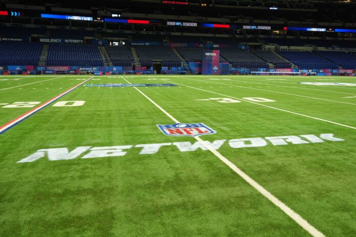 Feb 25, 2025; Indianapolis, IN, USA; The NFL Network logo on the field at the 2025 NFL Scouting Combine at Lucas Oil Stadium. Mandatory Credit: Kirby Lee-Imagn Images