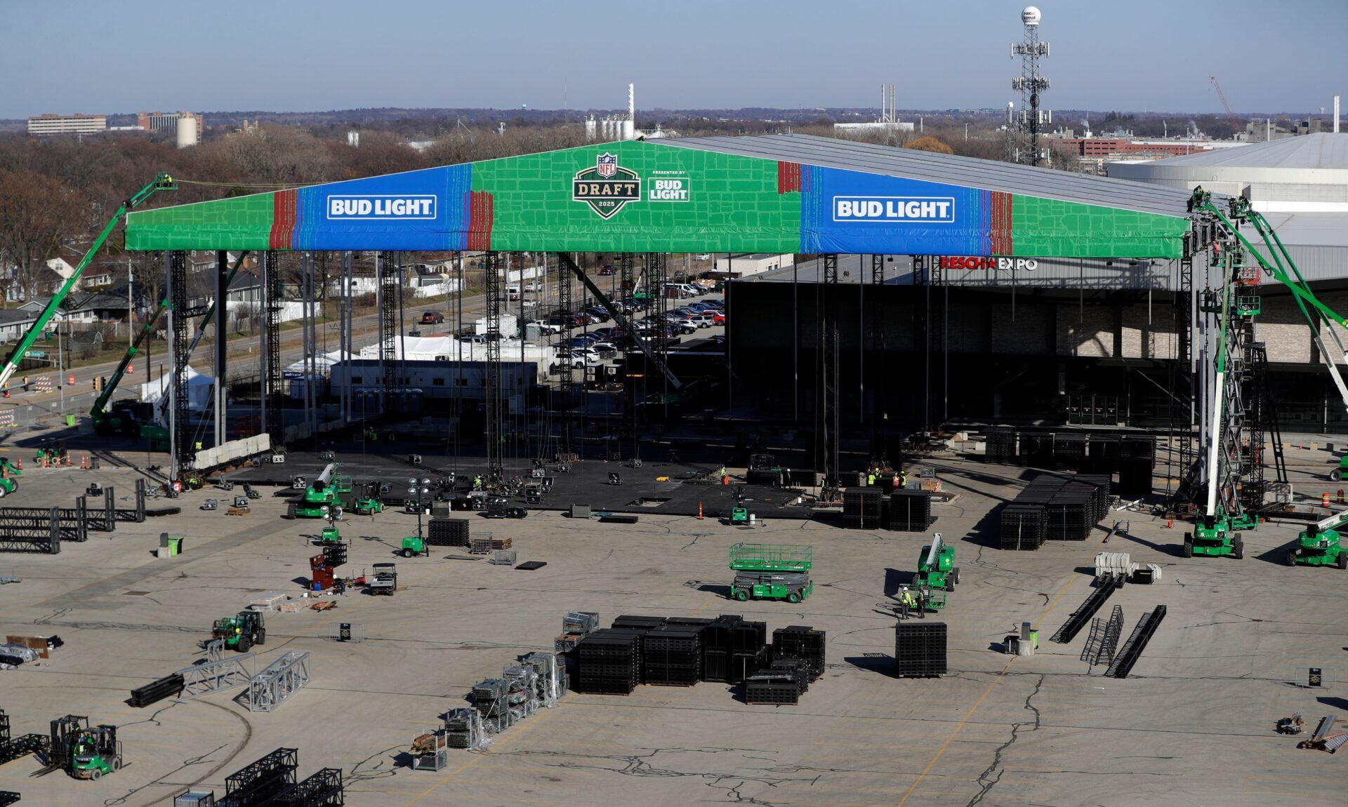 Crews work to construct NFL draft theater on April 11, 2025, in the parking lot of Lambeau Field in Green Bay, Wis.