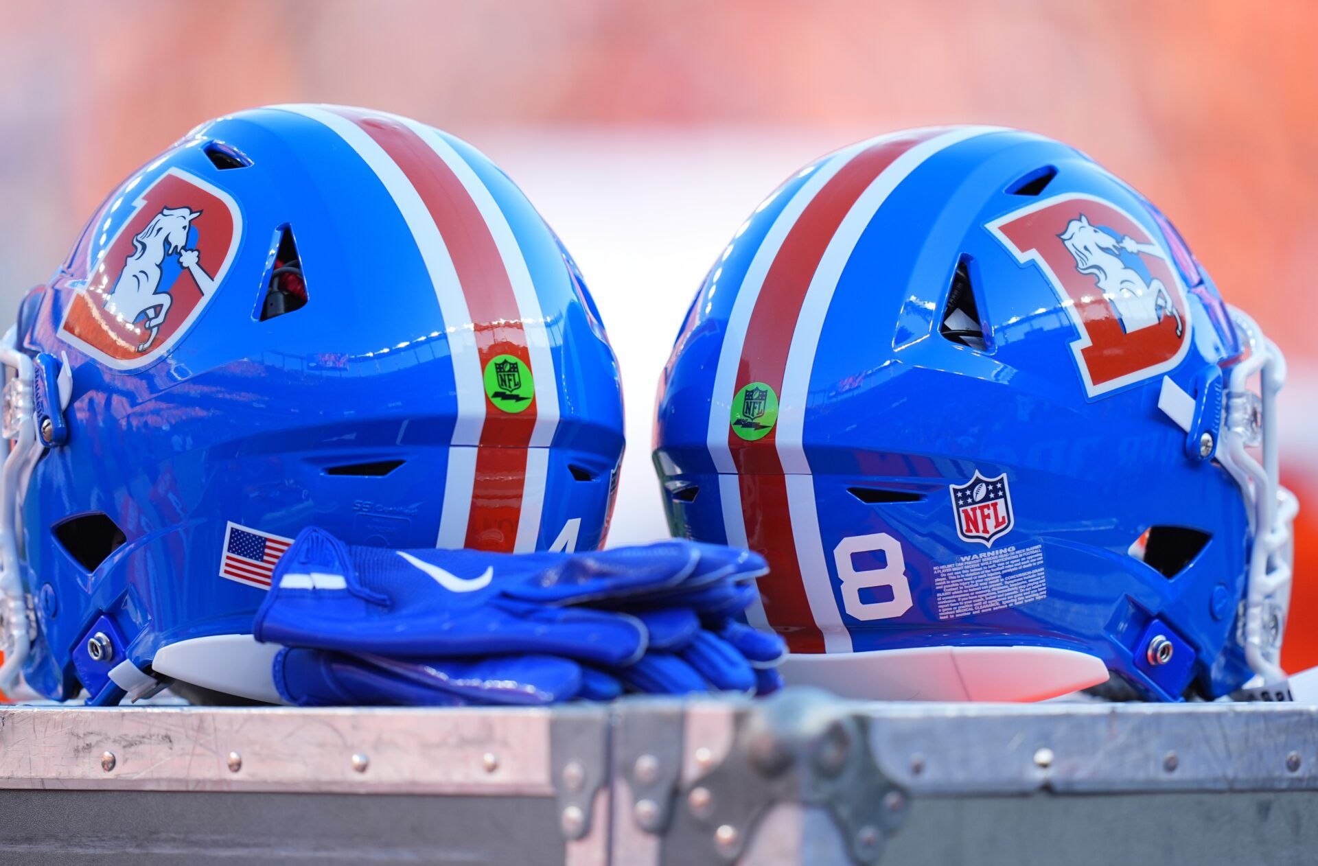 Detailed view of the throw back helmets worn by the Denver Broncos during the game against the Las Vegas Raiders at Empower Field at Mile High.