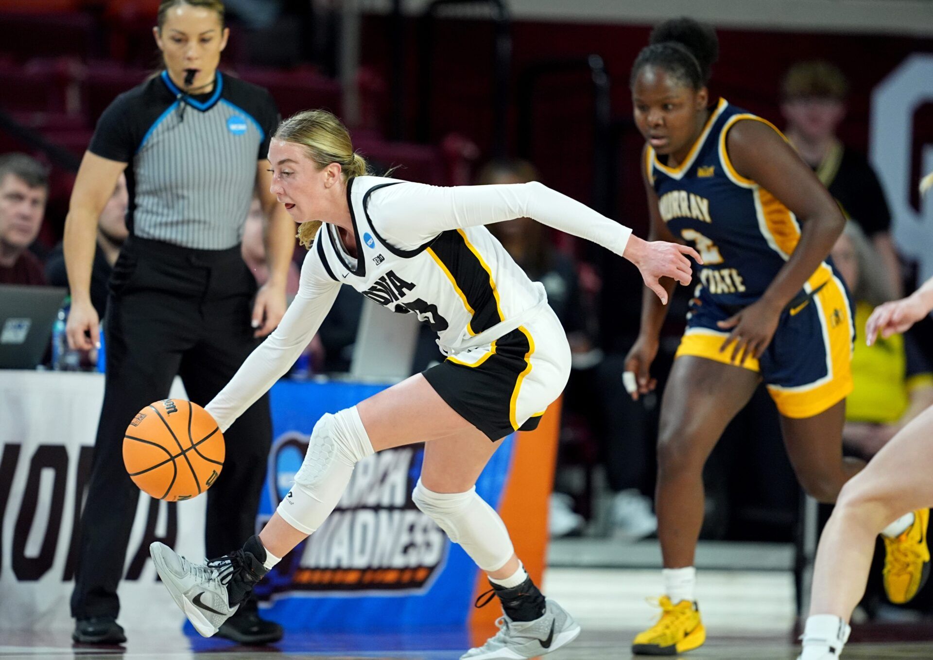 Iowa's Lucy Olsen (33) gets a loose ball during first half of the first round of the NCAA Women's college basketball game between Iowa and Murray State at the Lloyd Noble Center in Norman, Okla., Saturday, March, 22, 2025.