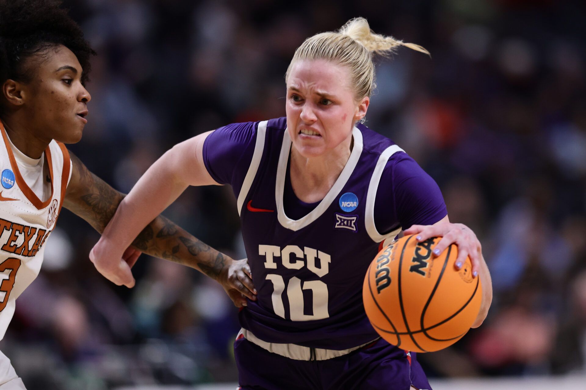 BIRMINGHAM, ALABAMA - MARCH 31: Hailey Van Lith #10 of the TCU Horned Frogs drives to the basket against Rori Harmon #3 of the Texas Longhorns during the second half in the Elite Eight round of the NCAA Women's Basketball Tournament at Legacy Arena at the BJCC on March 31, 2025 in Birmingham, Alabama. (Photo by Carmen Mandato/Getty Images)