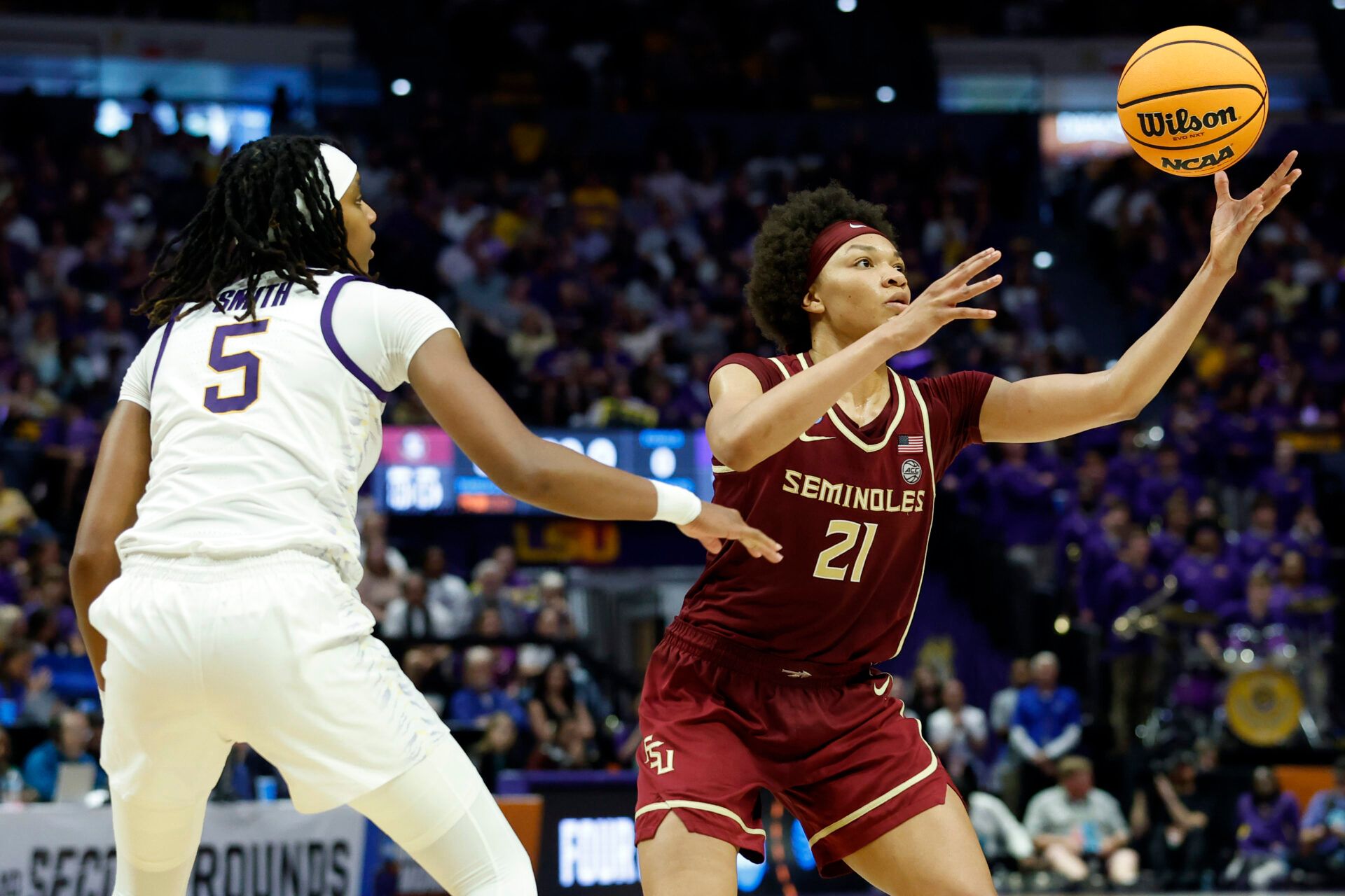 BATON ROUGE, LOUISIANA - MARCH 24: Makayla Timpson #21 of the Florida State Seminoles reaches for the ball as Sa'Myah Smith #5 of the LSU Lady Tigers defends in the second half during the second round of the 2025 NCAA women's basketball tournament held at Pete Maravich Assembly Center on March 24, 2025 in Baton Rouge, Louisiana. (Photo by Tyler Kaufman/Getty Images)