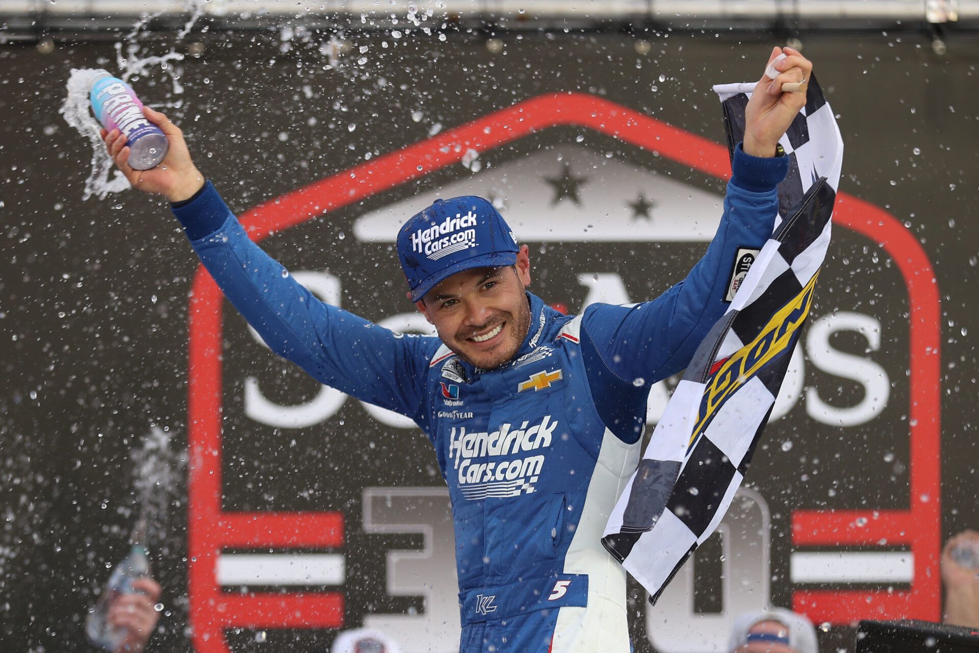 Apr 12, 2025; Bristol, Tennessee, USA; NASCAR Xfinity Series driver Kyle Larson (17) celebrates after winning the NASCAR SciAps 300 at Bristol Motor Speedway. Mandatory Credit: Randy Sartin-Imagn Images