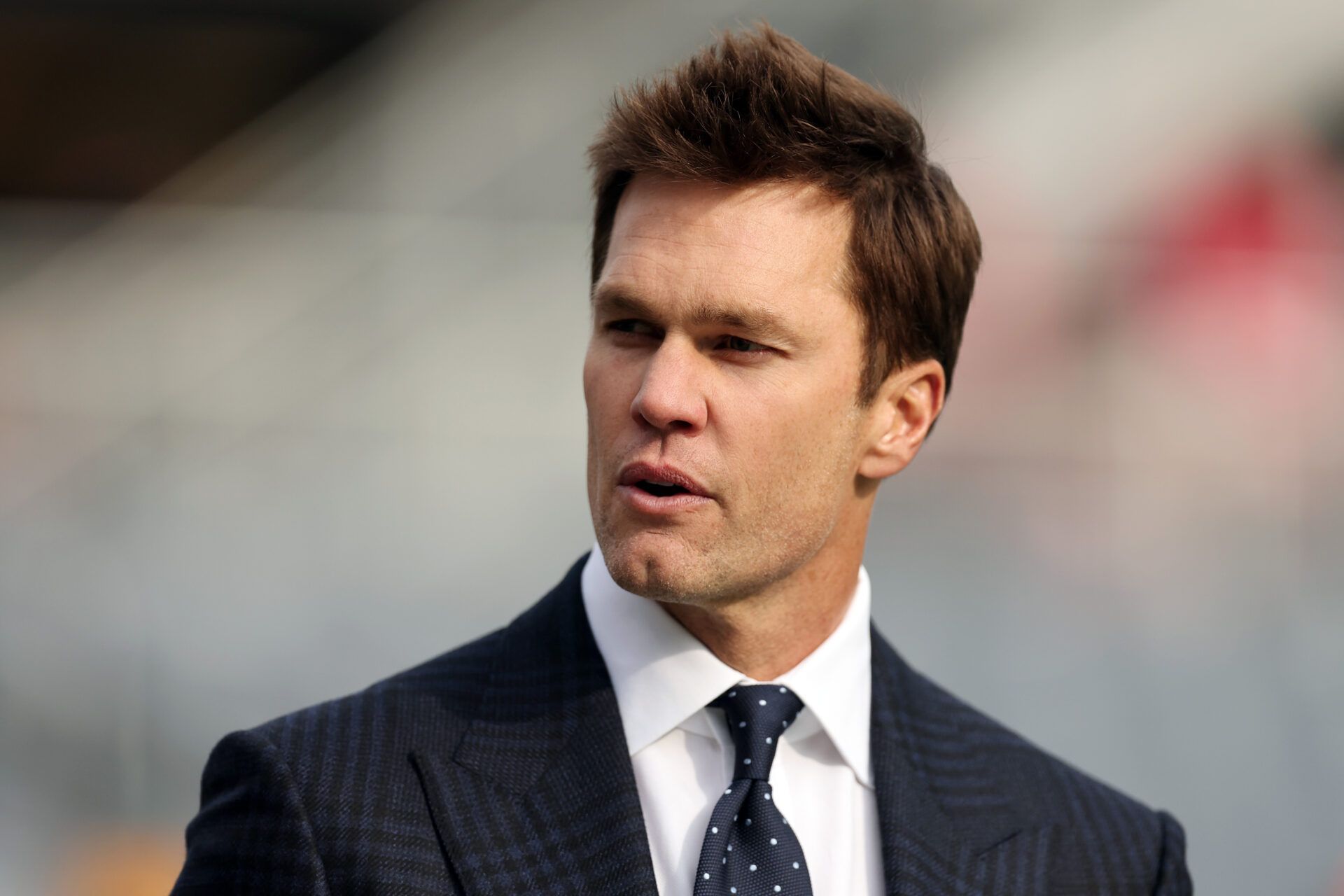CHICAGO, ILLINOIS - NOVEMBER 17: Former NFL player Tom Brady looks on prior to a game between the Chicago Bears and the Green Bay Packers at Soldier Field on November 17, 2024 in Chicago, Illinois. (Photo by Michael Reaves/Getty Images)