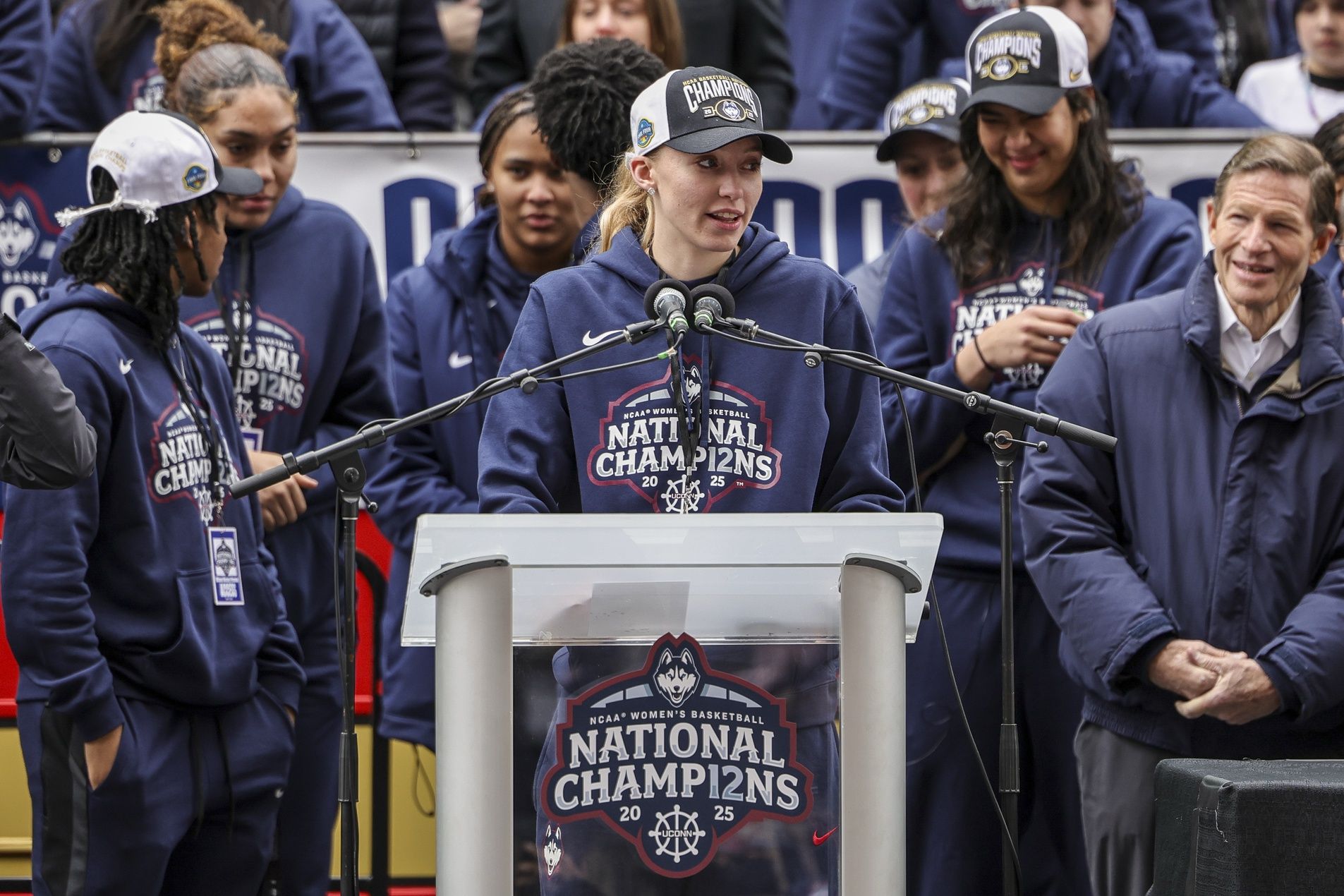 UConn student-athlete Paige Bueckers addresses the crowd during the Final Four champions victory parade and rally outside of the XL Center in Hartford, CT.