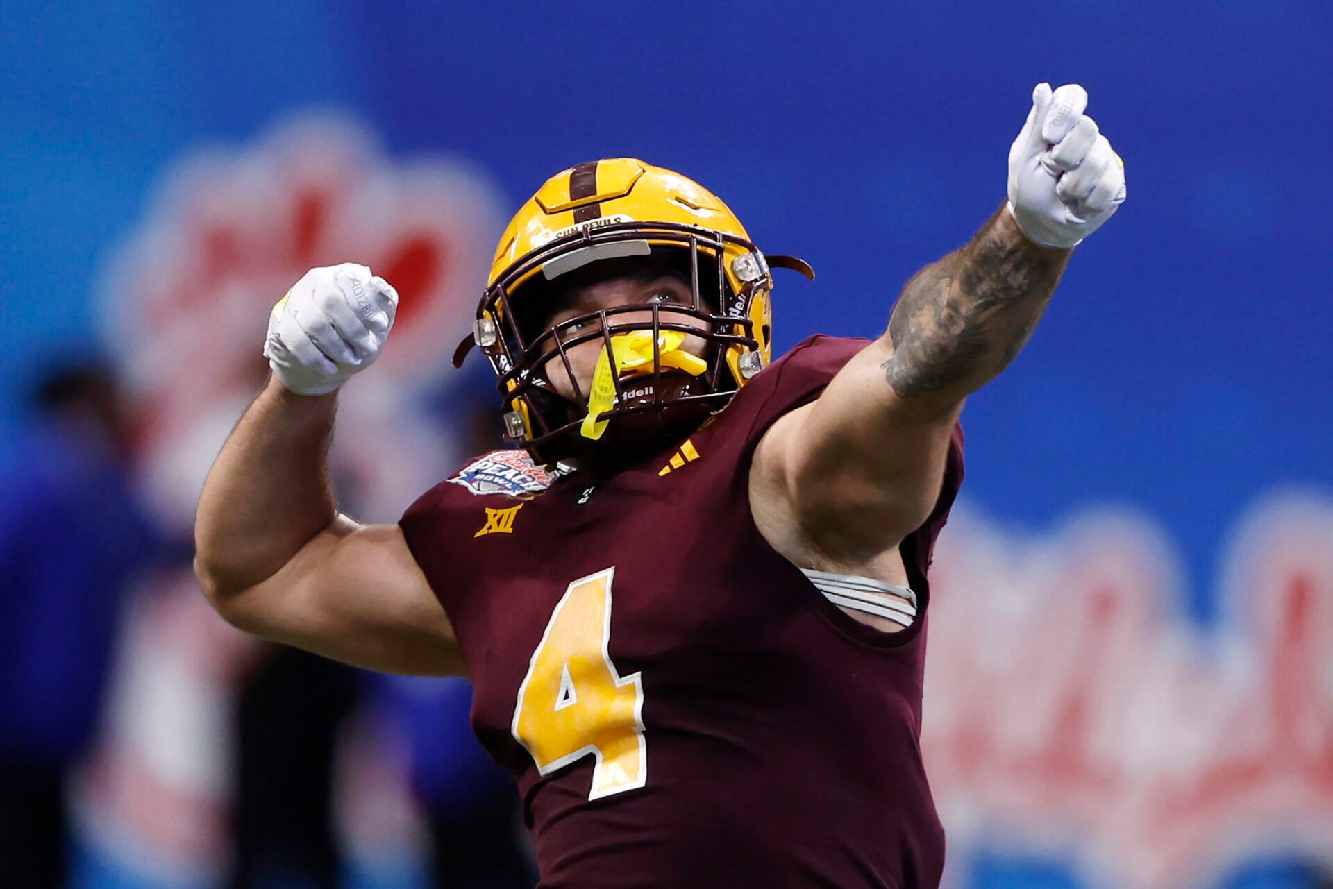 ATLANTA, GEORGIA - JANUARY 01: Cam Skattebo #4 of the Arizona State Sun Devils reacts after throwing a pass for a touchdown during the fourth quarter against the Texas Longhorns in the Chick-fil-A Peach Bowl at Mercedes-Benz Stadium on January 01, 2025 in Atlanta, Georgia. (Photo by Butch Dill/Getty Images)