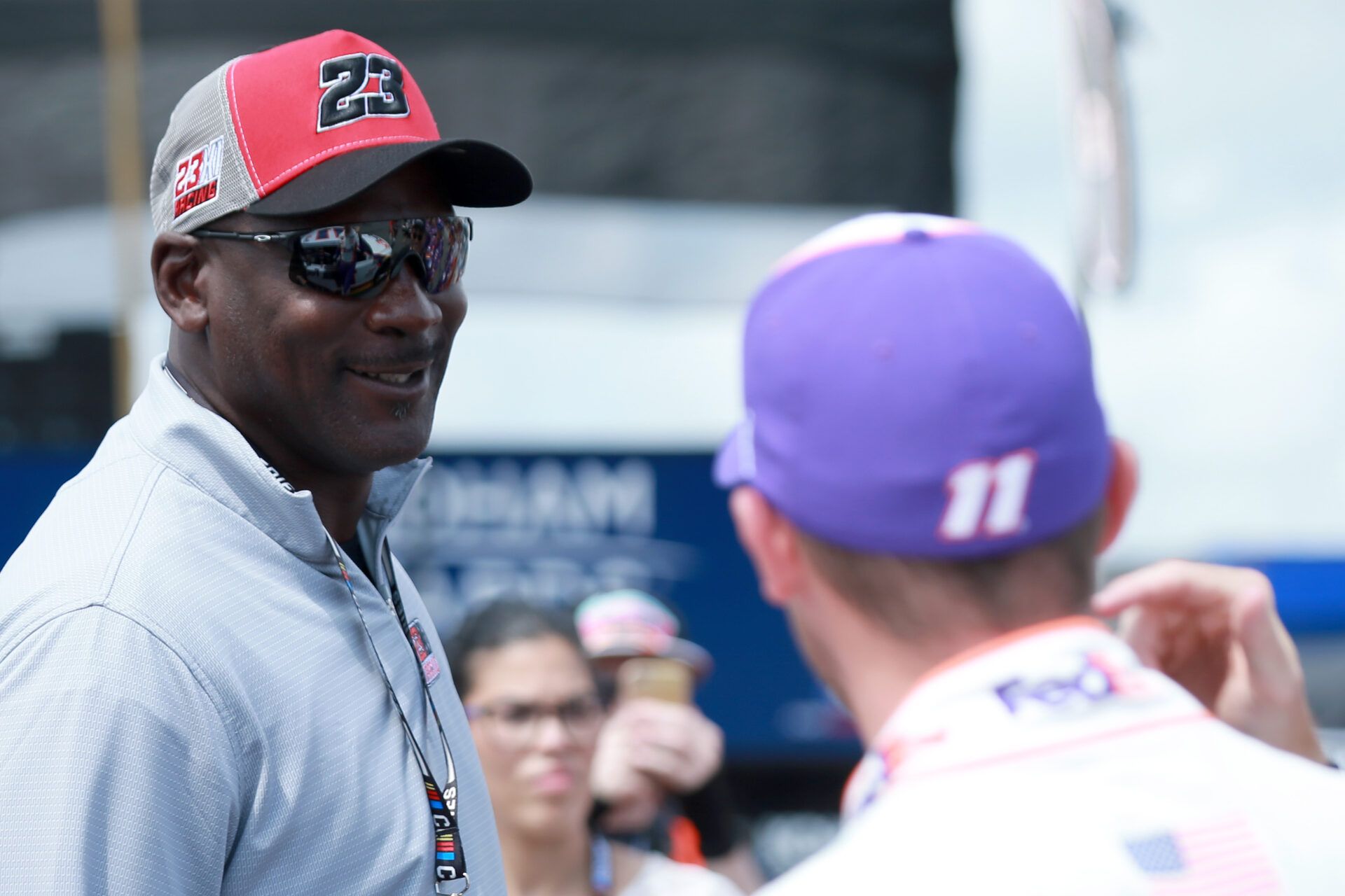 LONG POND, PENNSYLVANIA - JUNE 26: NBA Hall of Famer Michael Jordan meets with co-owner of 23XI Racing Denny Hamlin, driver of the #11 FedEx Ground Toyota, prior to the NASCAR Cup Series Pocono Organics CBD 325 at Pocono Raceway on June 26, 2021 in Long Pond, Pennsylvania. (Photo by Sean Gardner/23XI Racing via Getty Images)