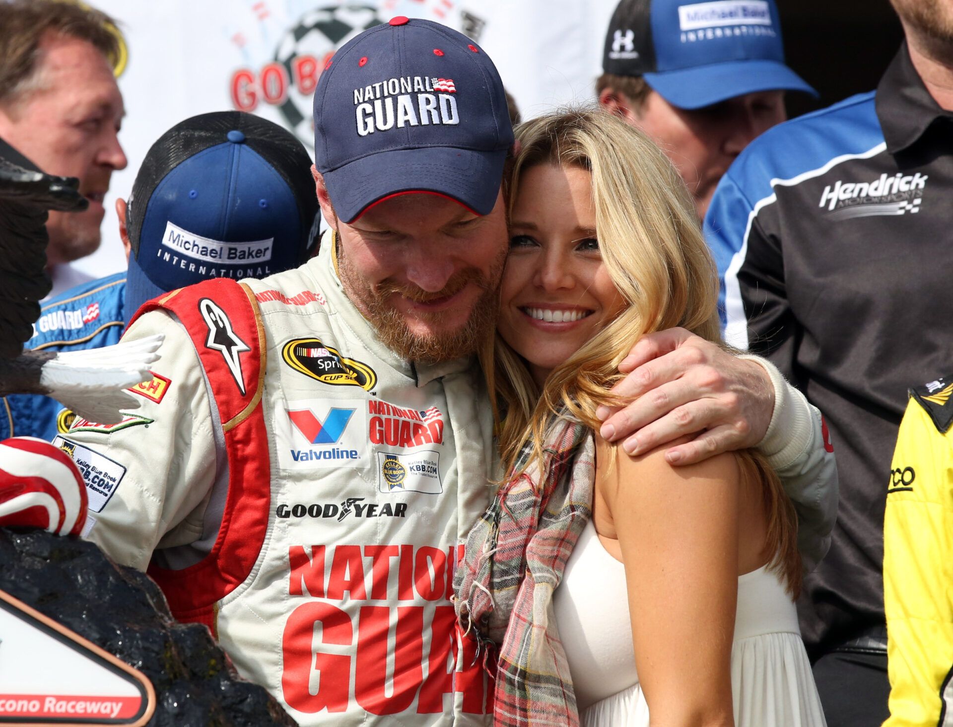 Aug 3, 2014; Long Pond, PA, USA; NASCAR Sprint Cup Series driver Dale Earnhardt Jr. (88) hugs his girlfriend Amy Reimann on victory lane after winning the GoBowling.com 400 at Pocono Raceway. Mandatory Credit: Bill Streicher-USA TODAY Sports