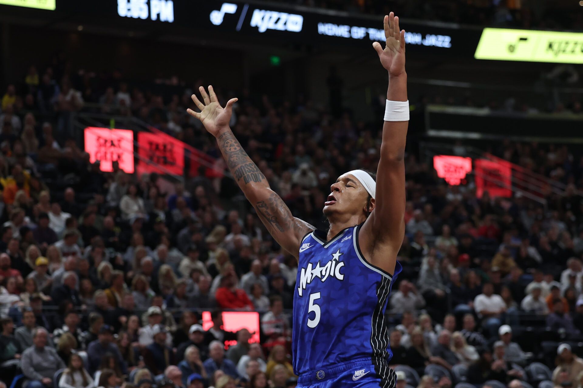 Nov 2, 2023; Salt Lake City, Utah, USA; Orlando Magic forward Paolo Banchero (5) reacts to a dunk against the Utah Jazz in the second quarter at the Delta Center. Mandatory Credit: Rob Gray-USA TODAY Sports