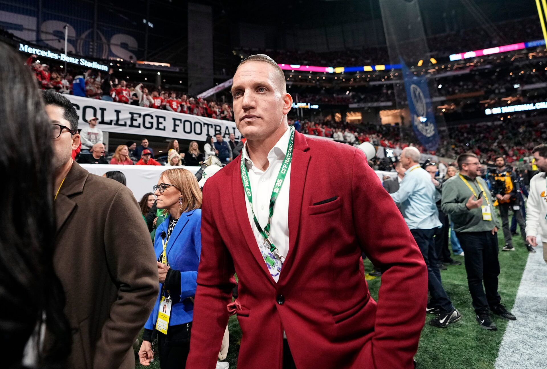 Former Ohio State Buckeye A.J. Hawk walks the sidelines during warm ups before the start of the College Football Playoff National Championship at Mercedes-Benz Stadium in Atlanta on January 20, 2025.