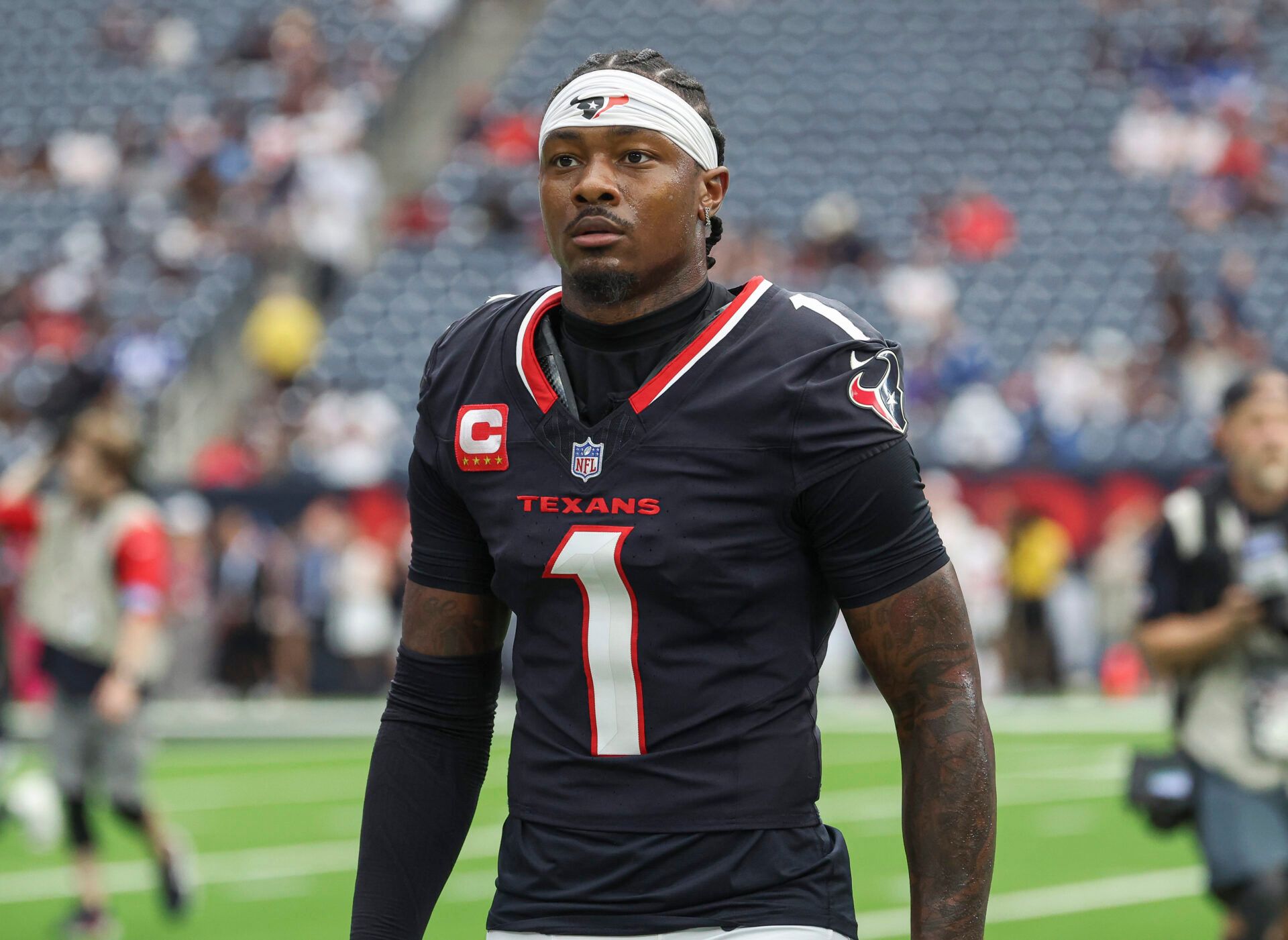 Oct 27, 2024; Houston, Texas, USA; Houston Texans wide receiver Stefon Diggs (1) walks towards the sideline before the game against the Indianapolis Colts at NRG Stadium. Mandatory Credit: Troy Taormina-Imagn Images