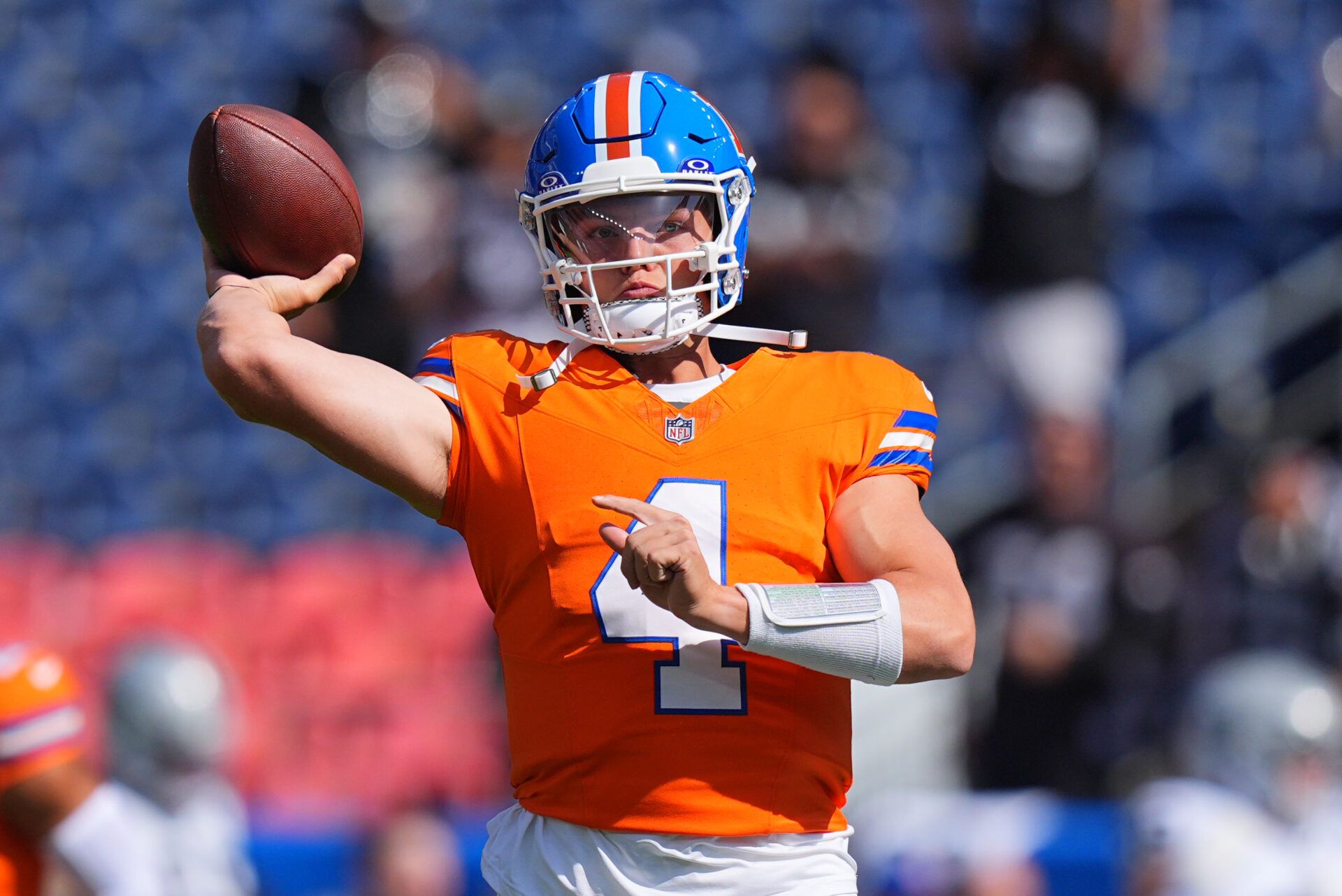 Oct 6, 2024; Denver, Colorado, USA; Denver Broncos quarterback Zach Wilson (4) warms up before the game against the Las Vegas Raiders at Empower Field at Mile High. Mandatory Credit: Ron Chenoy-Imagn Images