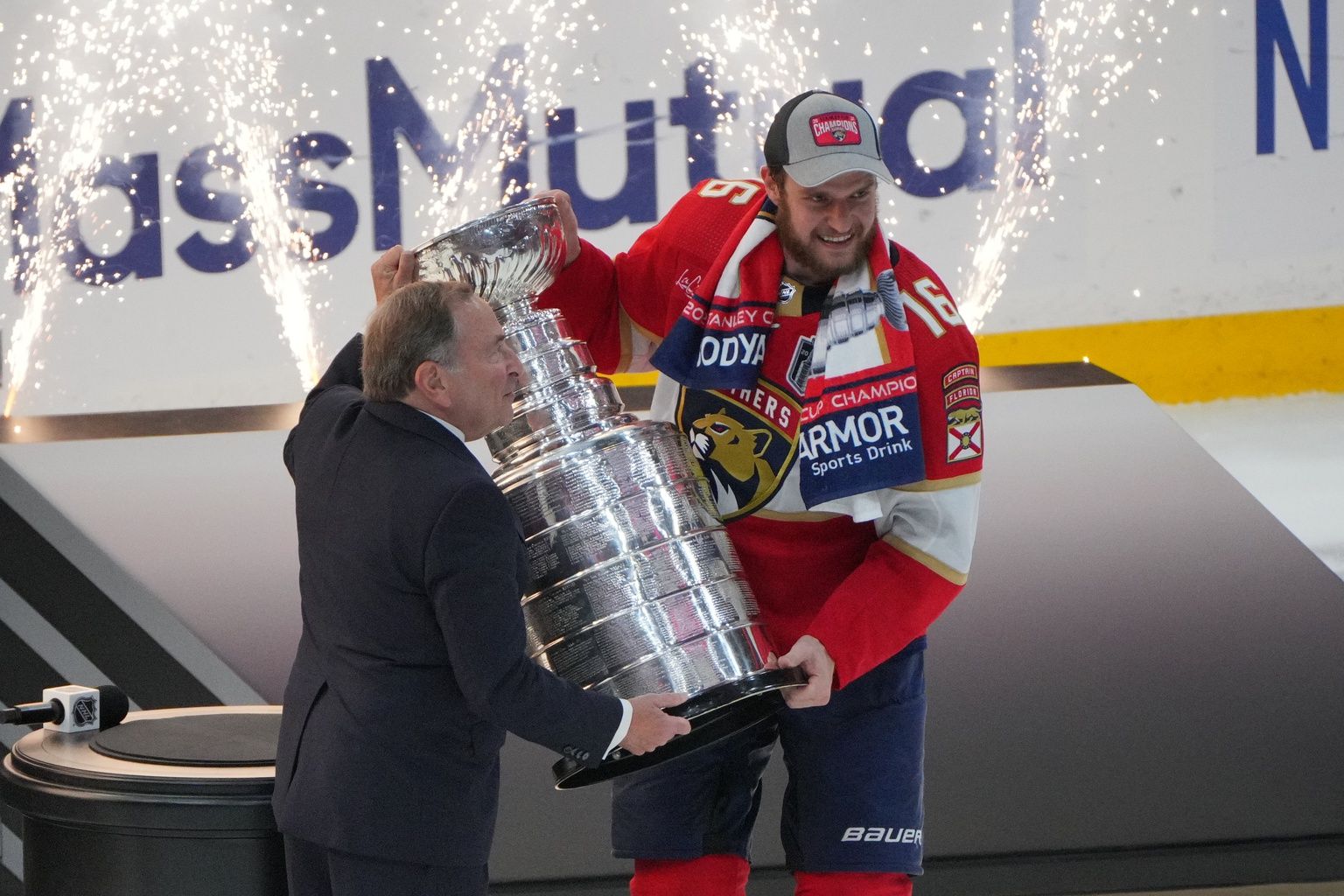 The Stanley Cup is presented to Florida Panthers forward Aleksander Barkov (16) by NHL Commissioner Gary Bettman after winning against the Edmonton Oilers in game seven of the 2024 Stanley Cup Final at Amerant Bank Arena.