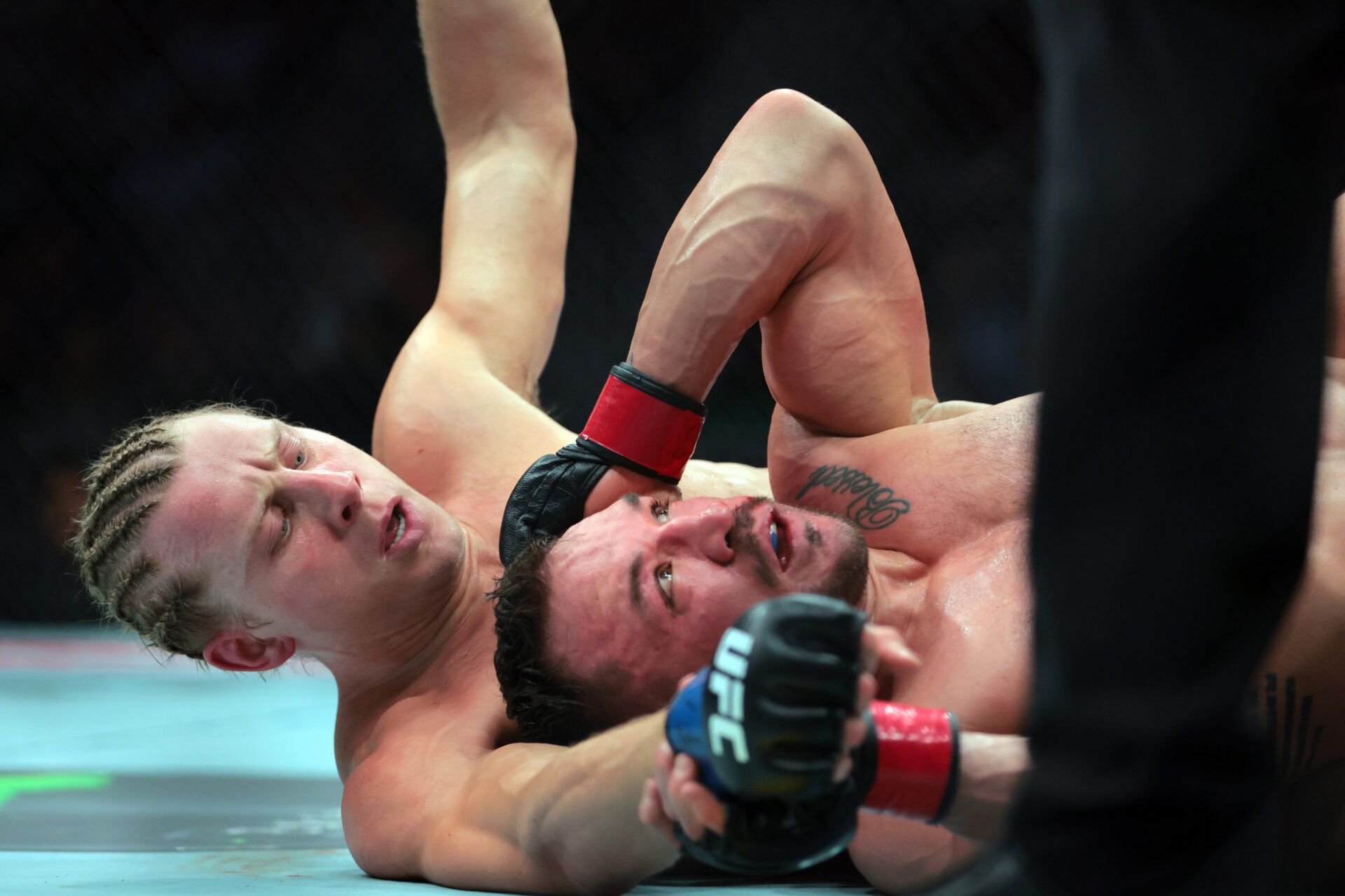 Apr 12, 2025; Miami, Florida, UNITED STATES; Michael Chandler (red gloves) fights against Paddy Pimblett (blue gloves) during UFC 314 at Kaseya Center. Mandatory Credit: Sam Navarro-Imagn Images