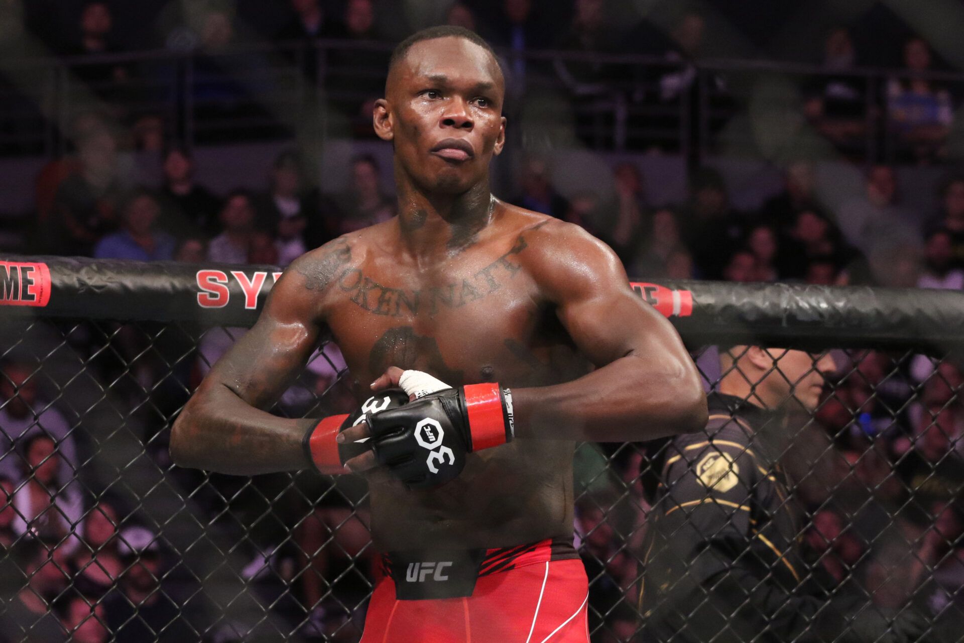 Israel Adesanya reacts during his fight with Sean Strickland (not pictured) in UFC 293 at Qudos Bank Arena.