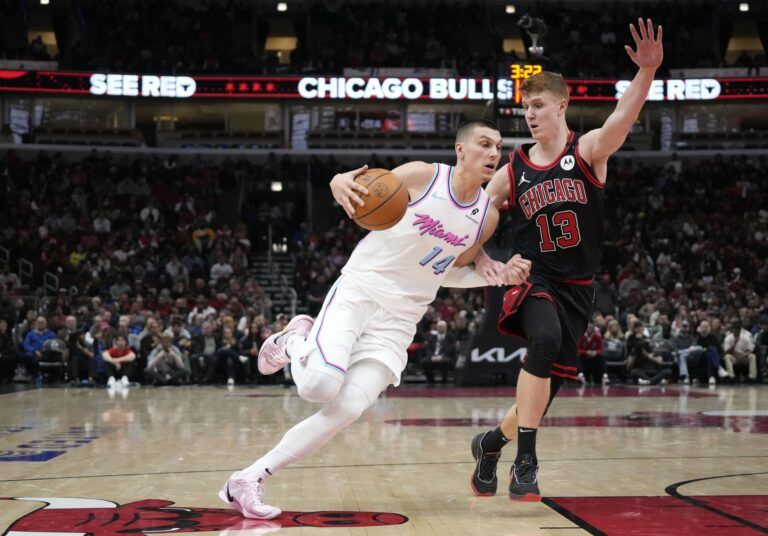 Chicago Bulls guard Kevin Huerter (13) defends Miami Heat guard Tyler Herro (14) during the second half at United Center.