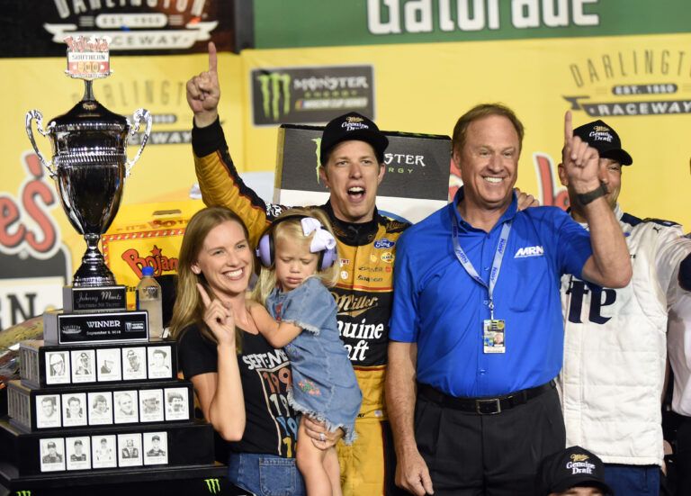 Sep 2, 2018; Darlington, SC, USA; Monster Energy NASCAR Cup Series driver Brad Keselowski (2) celebrates with his wife Paige White, daughter Scarlet Keselowski , and former driver Rusty Wallace after winning the Bojangles' Southern 500 at Darlington Raceway. Mandatory Credit: Adam Hagy-USA TODAY Sports