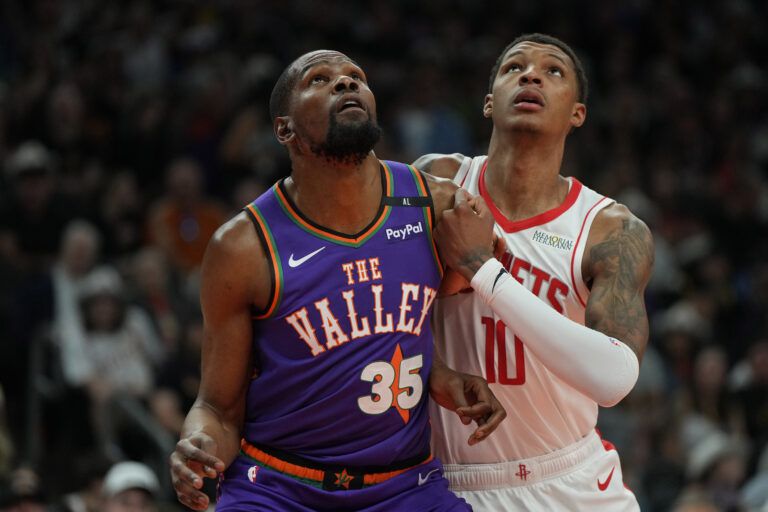 Mar 30, 2025; Phoenix, Arizona, USA; Phoenix Suns forward Kevin Durant (35) and Houston Rockets forward Jabari Smith Jr. (10) fight for position in the first half at Footprint Center. Mandatory Credit: Rick Scuteri-Imagn Images