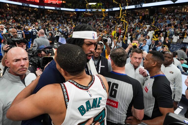 Mavericks' Anthony Davis (3) and Grizzlies' Desmond Bane (22) hug and speak to each other after the Grizzlies defeated the Mavericks 120-106 in the play-in game to secure a spot in the NBA Playoffs at FedExForum in Memphis, Tenn., on Friday, April 18, 2025.