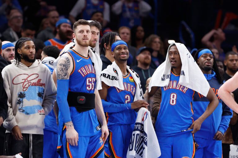 Feb 10, 2025; Oklahoma City, Oklahoma, USA; Oklahoma City Thunder guard Isaiah Joe (11), center Isaiah Hartenstein (55), forward Chet Holmgren (7), guard Shai Gilgeous-Alexander (2), forward Jalen Williams (8) and guard Luguentz Dort (5) watch the end of a game against the New Orleans Pelicans at Paycom Center. Mandatory Credit: Alonzo Adams-Imagn Images