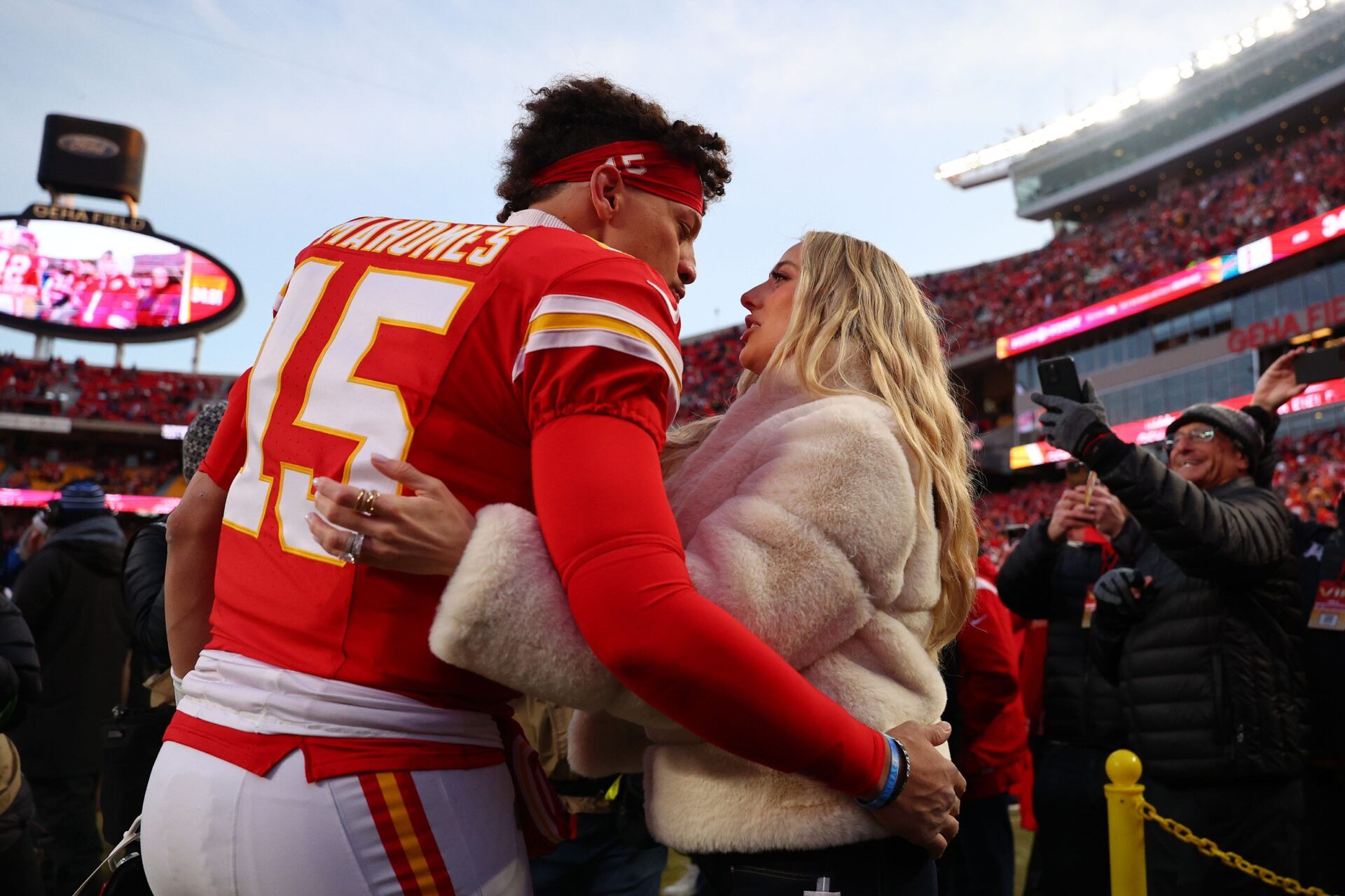 Kansas City Chiefs quarterback Patrick Mahomes (15) and Brittany Mahomes react before the AFC Championship game against the Buffalo Bills at GEHA Field at Arrowhead Stadium.